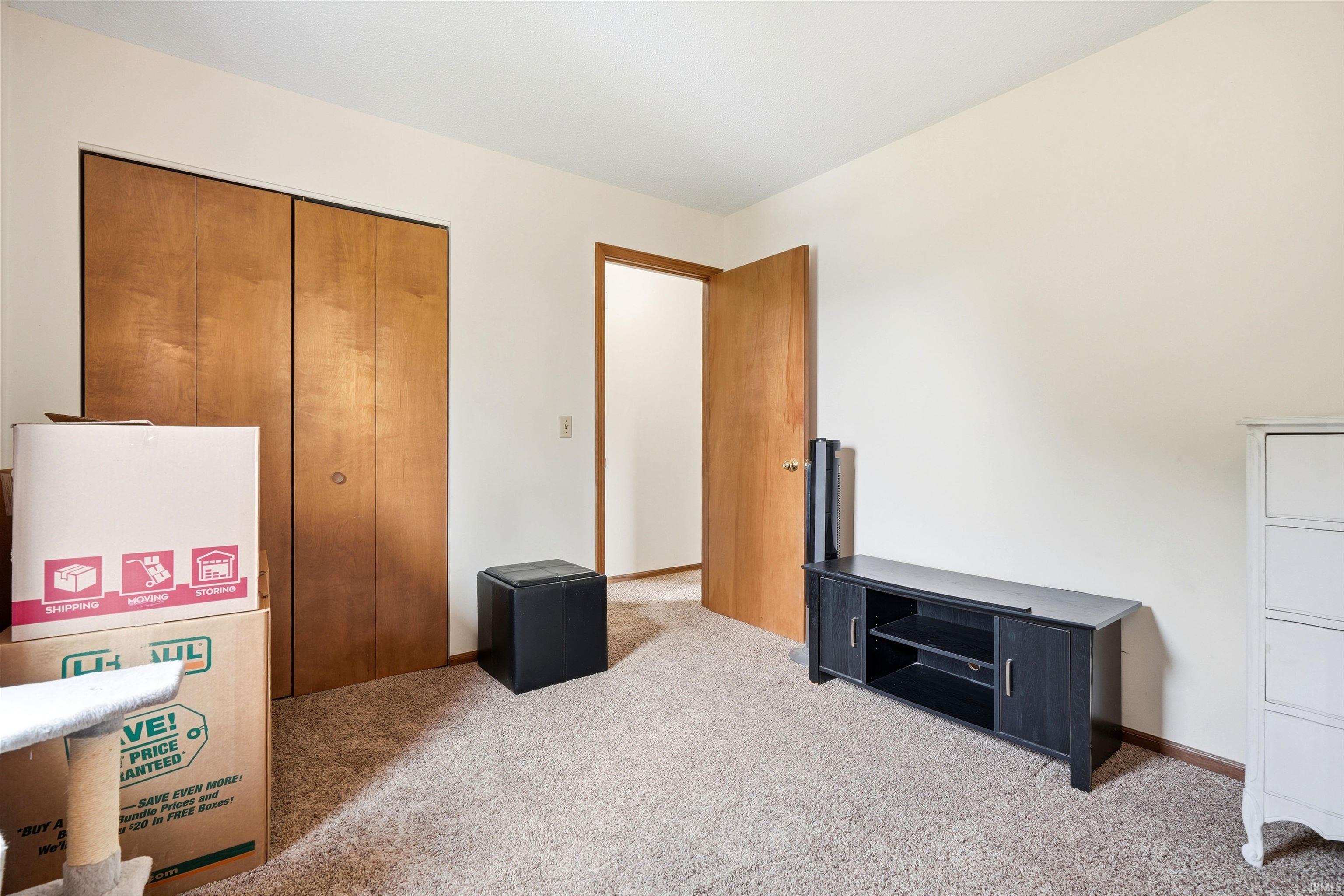 Neutral wall color with textured carpeting