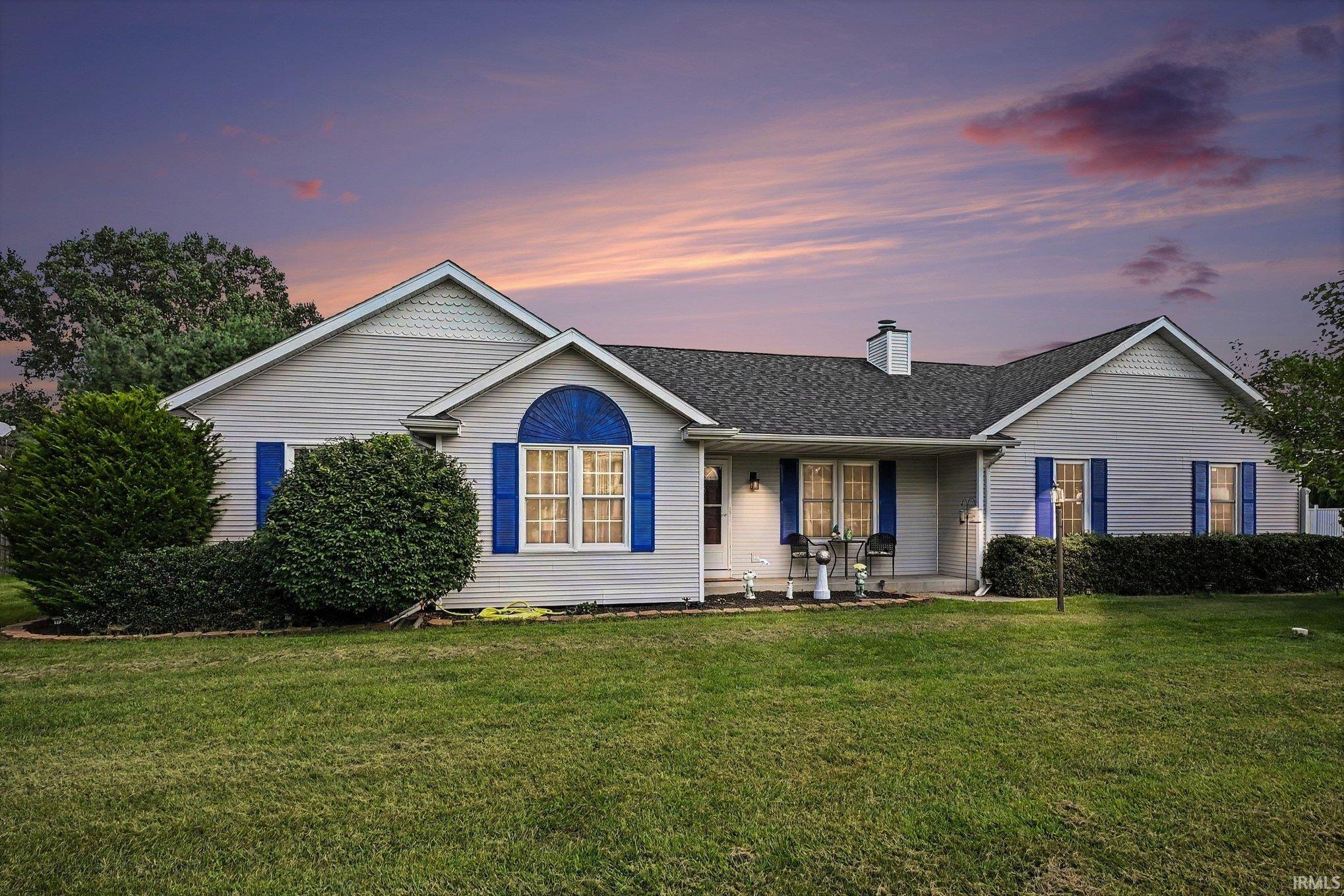 Ranch-style residence featuring siding exterior, a front porch, and a shingled roof