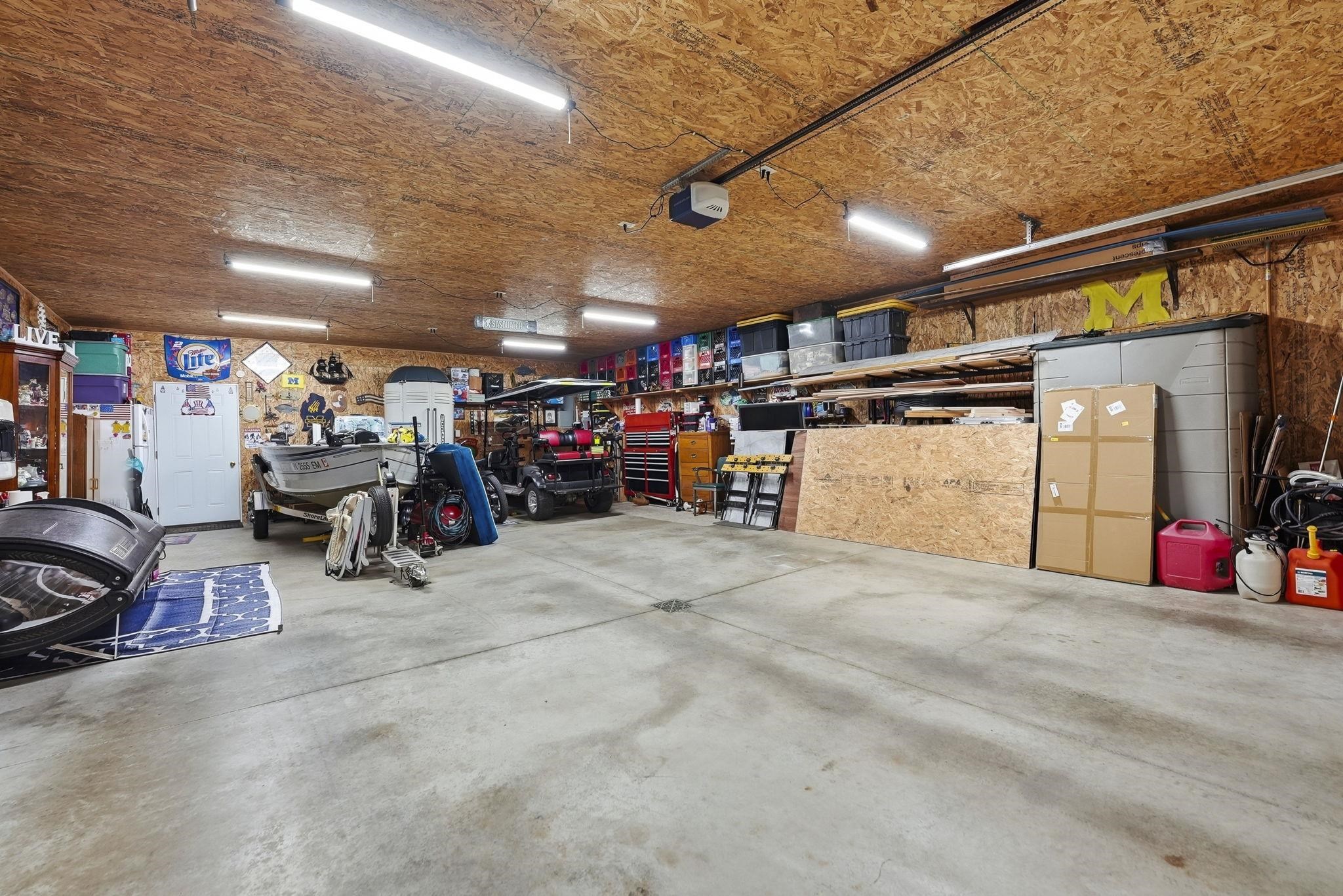 Concrete flooring, wood-finish ceiling, and fluorescent lighting