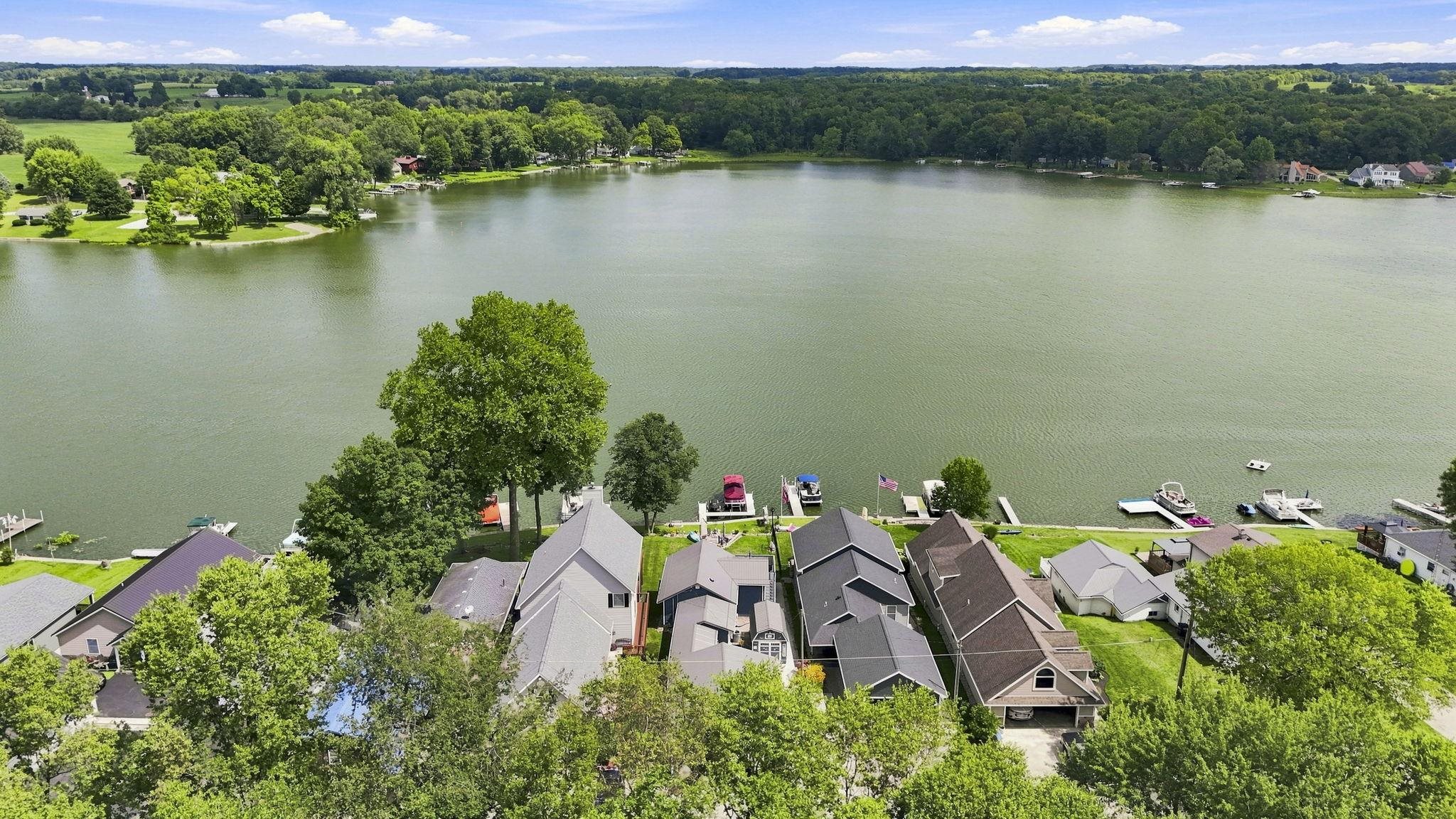 Waterfront properties featuring private docks and mature trees