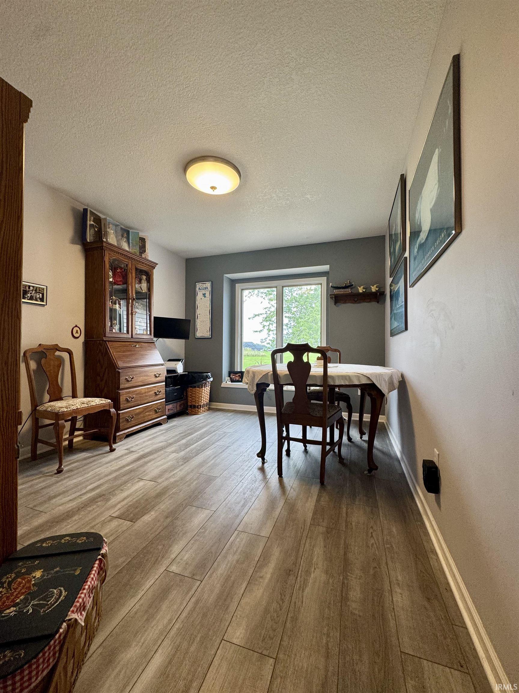 Wood-finish plank flooring throughout