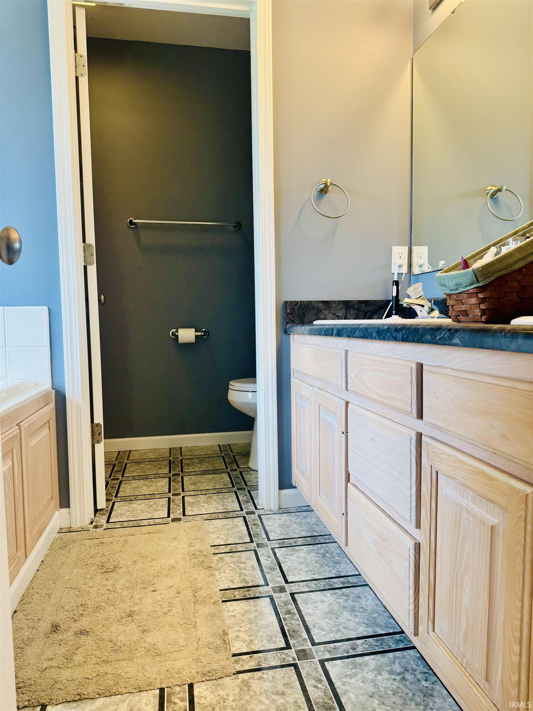 Light wood-finish vanity with ample storage