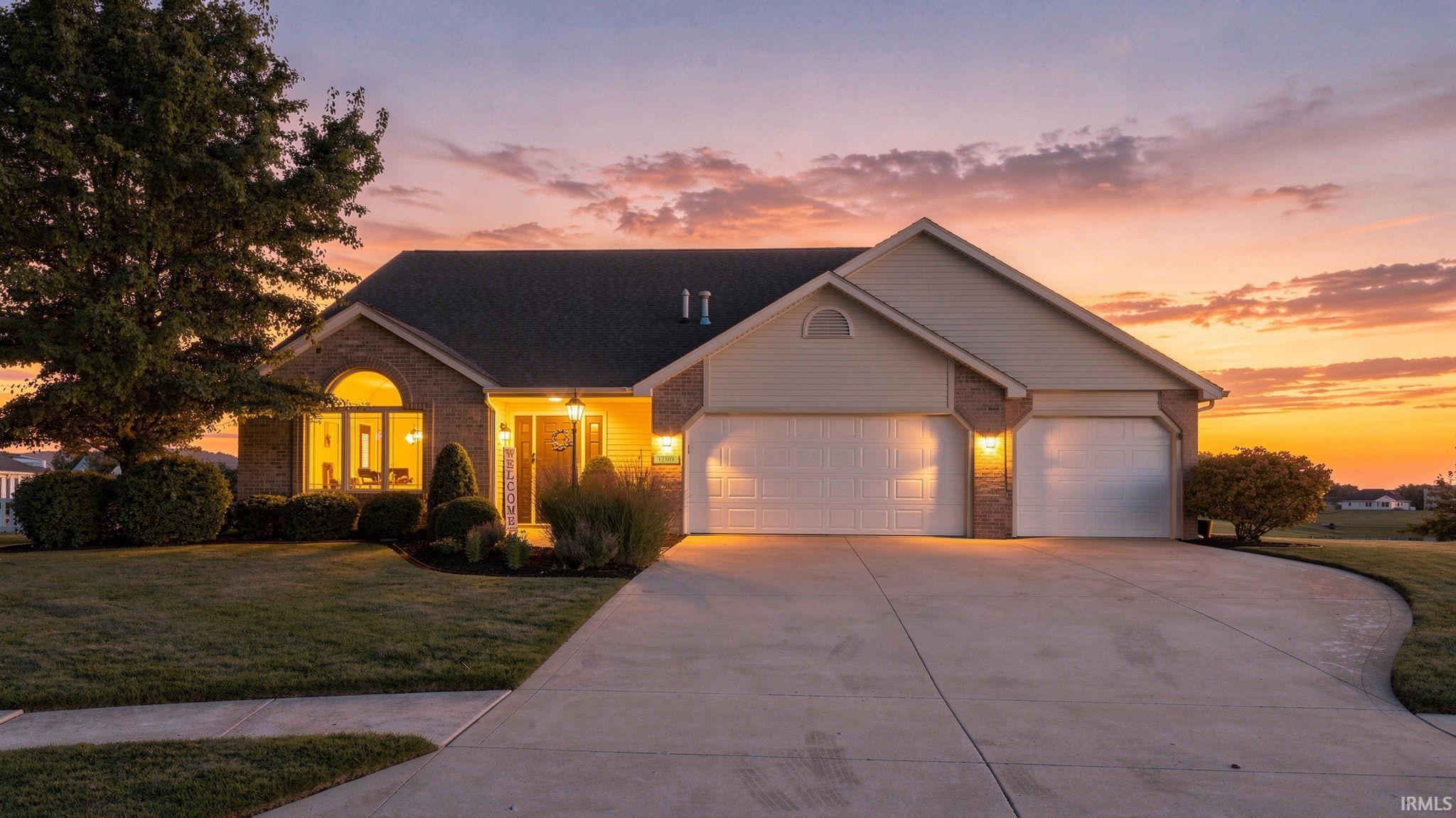 Brick and siding exterior with a dark shingle roof