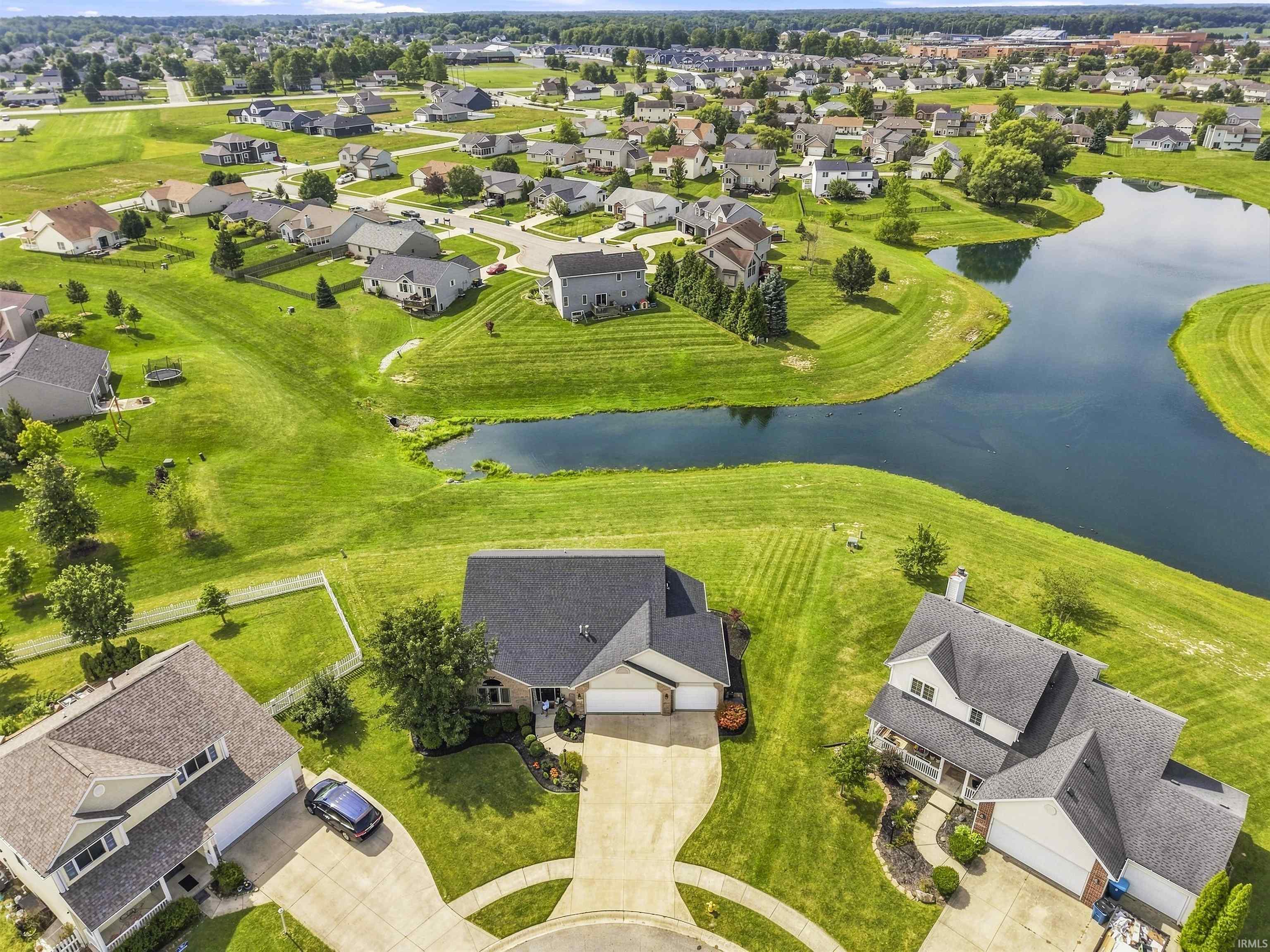 Established neighborhood with mature landscaping, featuring houses on spacious lots