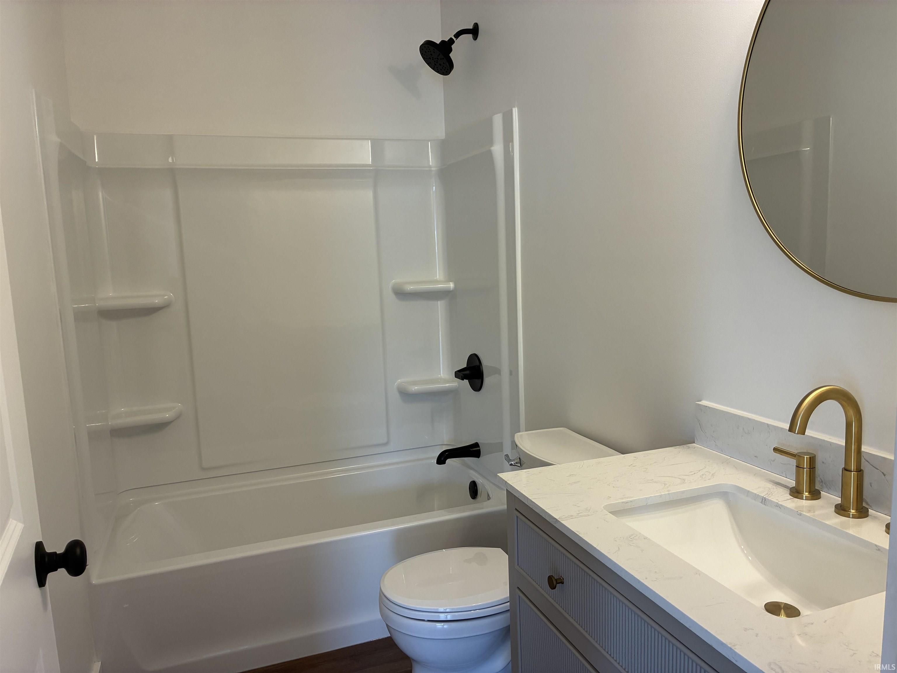 White shower/tub combination with matte black fixtures