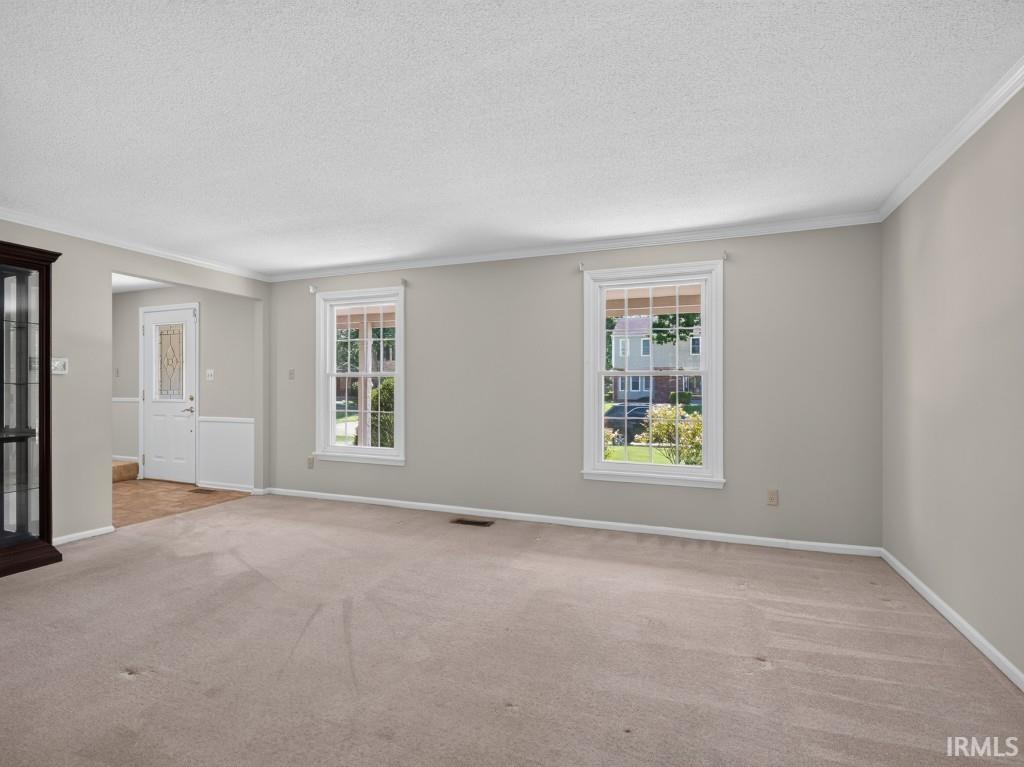 Neutral-toned walls with white crown molding