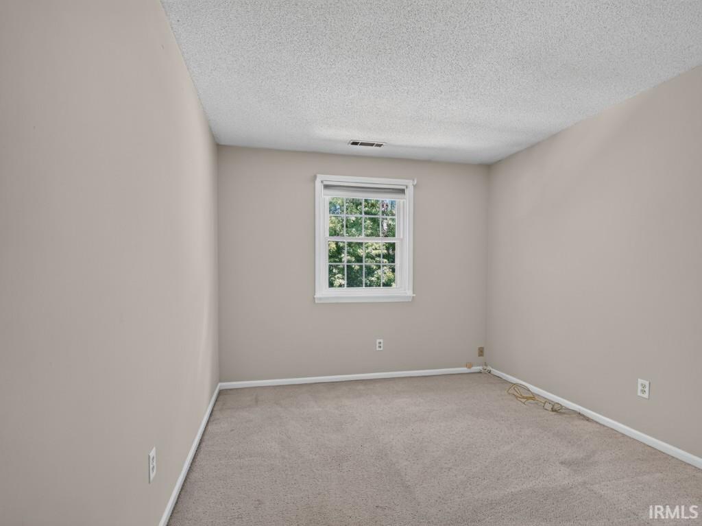 Neutral-toned walls and carpeting