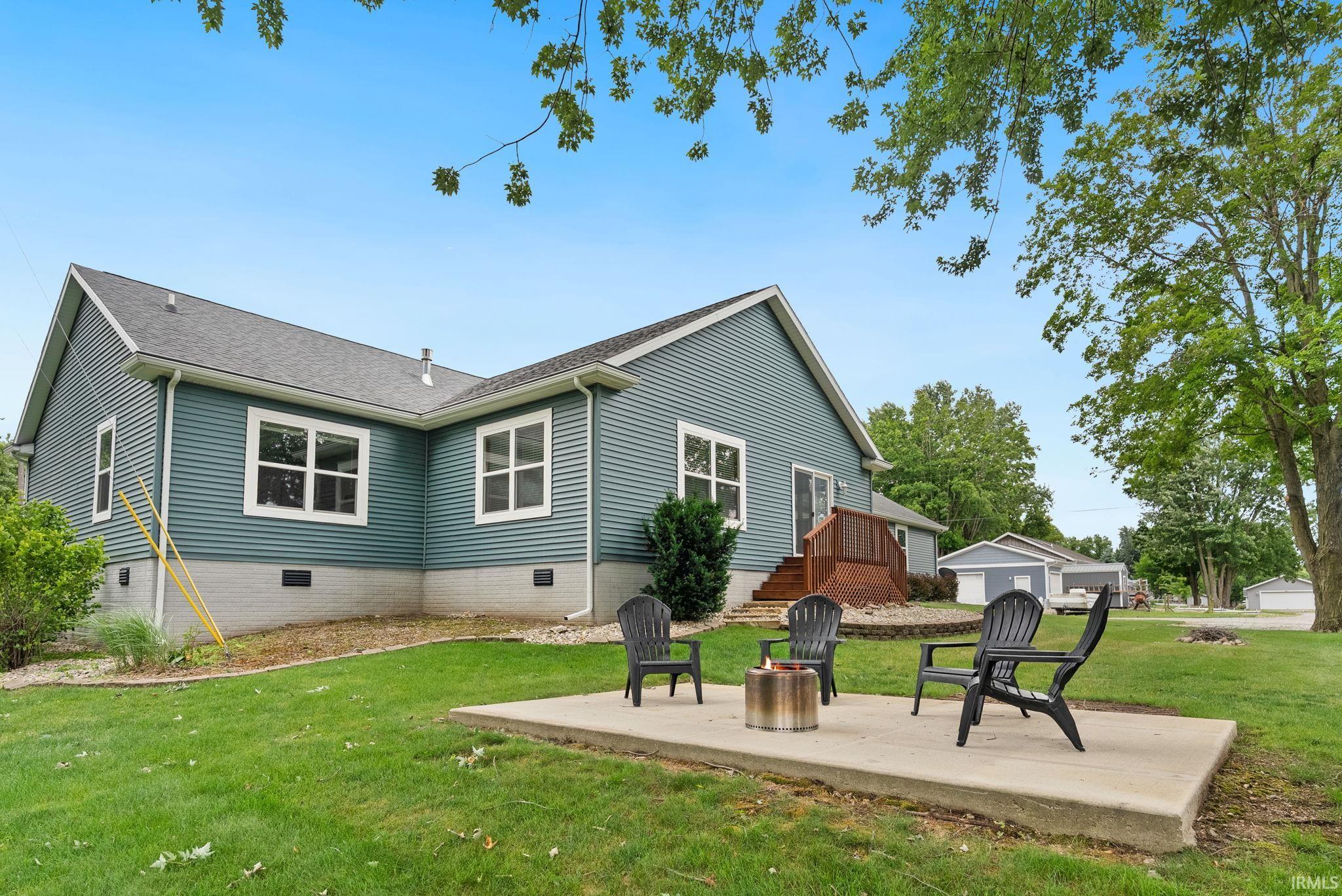 Expansive backyard with a concrete patio