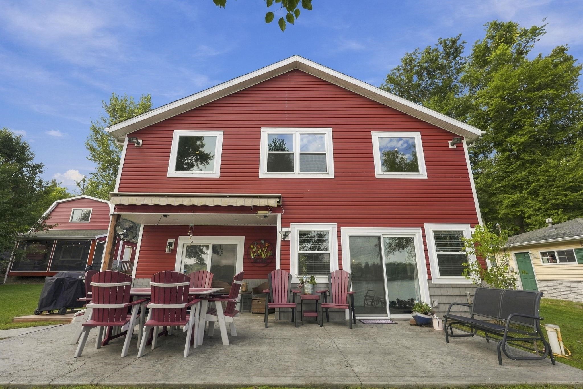 Red siding exterior with white trim