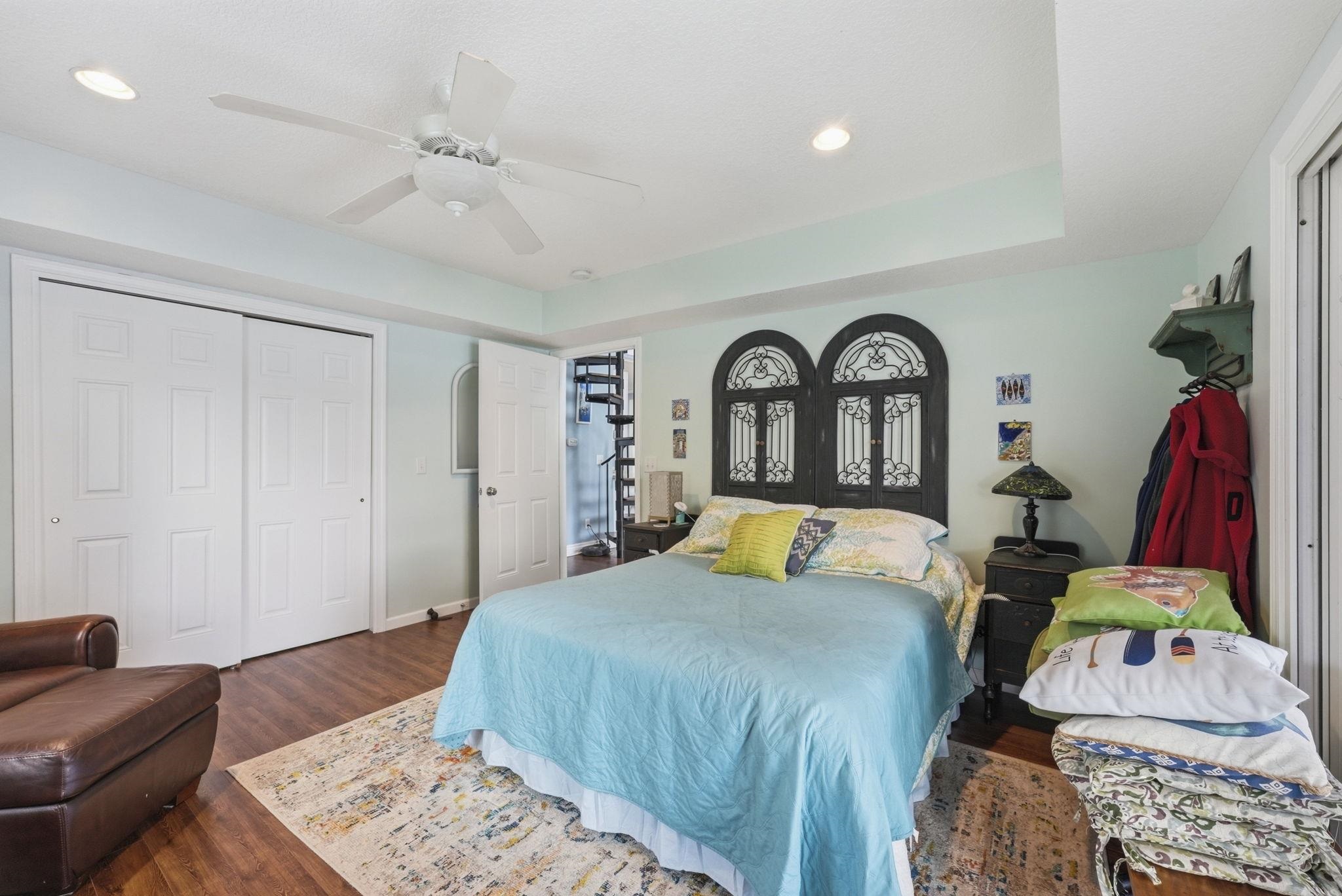 Wood-finish flooring, recessed lighting, and a ceiling fan
