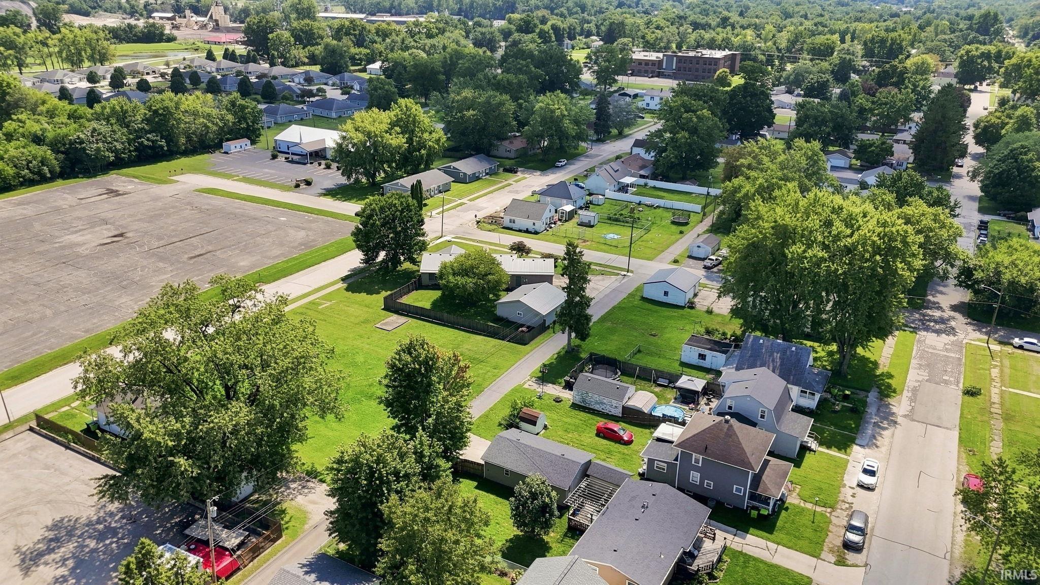 Aerial perspective of a residential neighborhood with mature trees