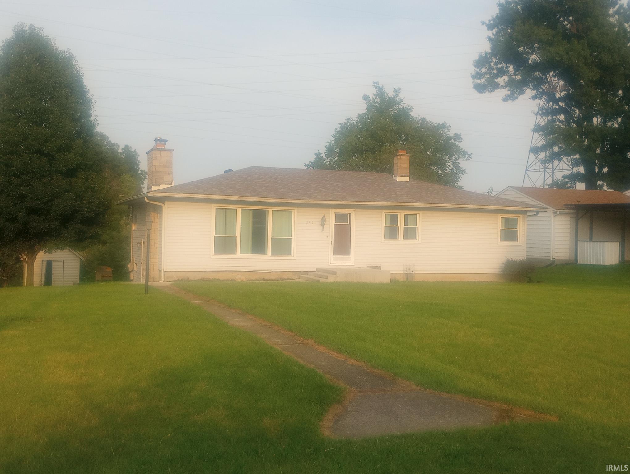 This 4 bedroom house has an open floor plan, 2 fireplaces, and a full partially finished basement on the corner lot. The property is in a quiet neighborhood, has fruit trees in the back of the property and backs up to farmland. The roof, carpet, & basement windows are all new in 2026, furnace, AC, front windows only 5 years old.