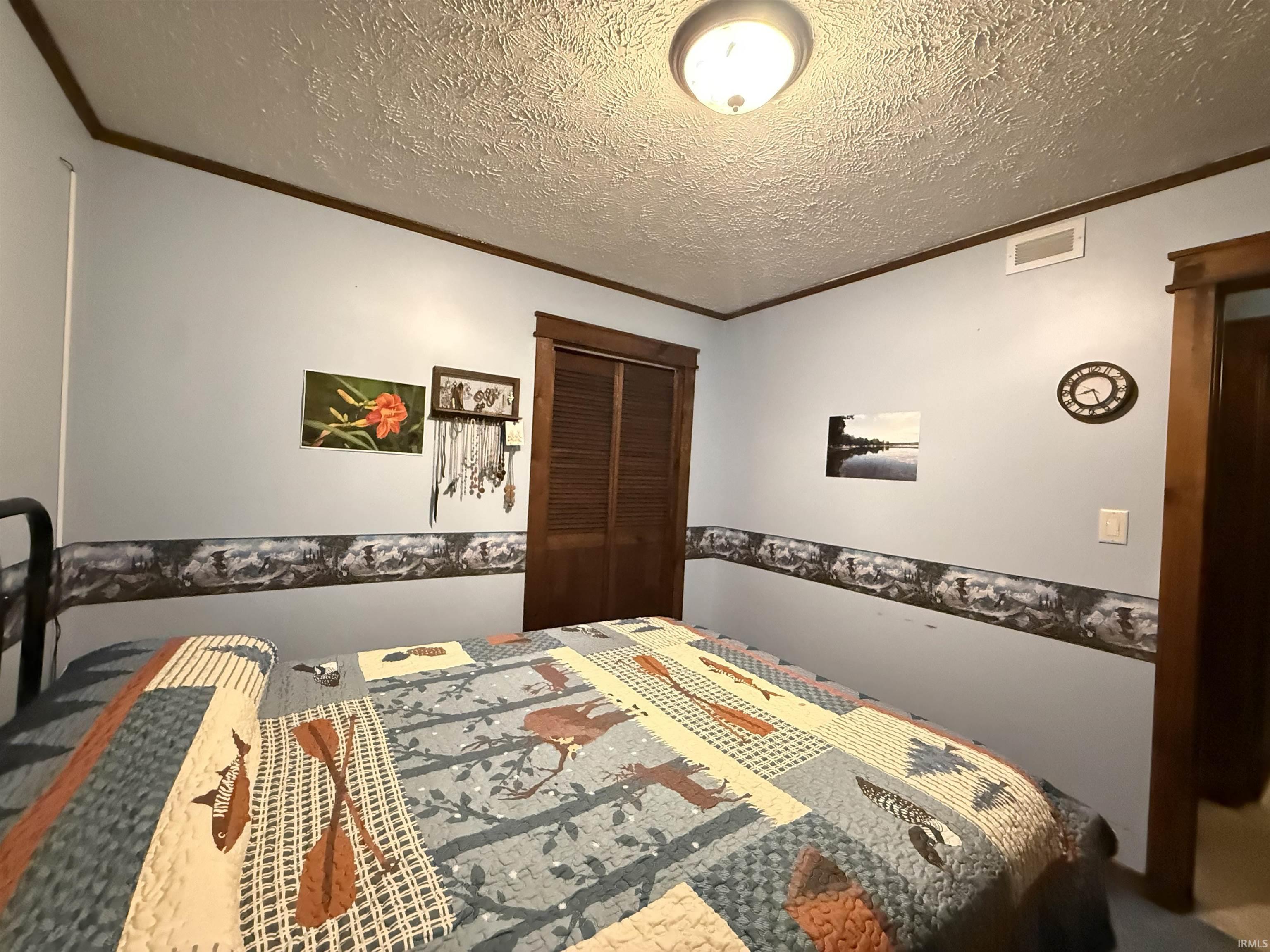 Textured ceiling with a flush-mount light fixture