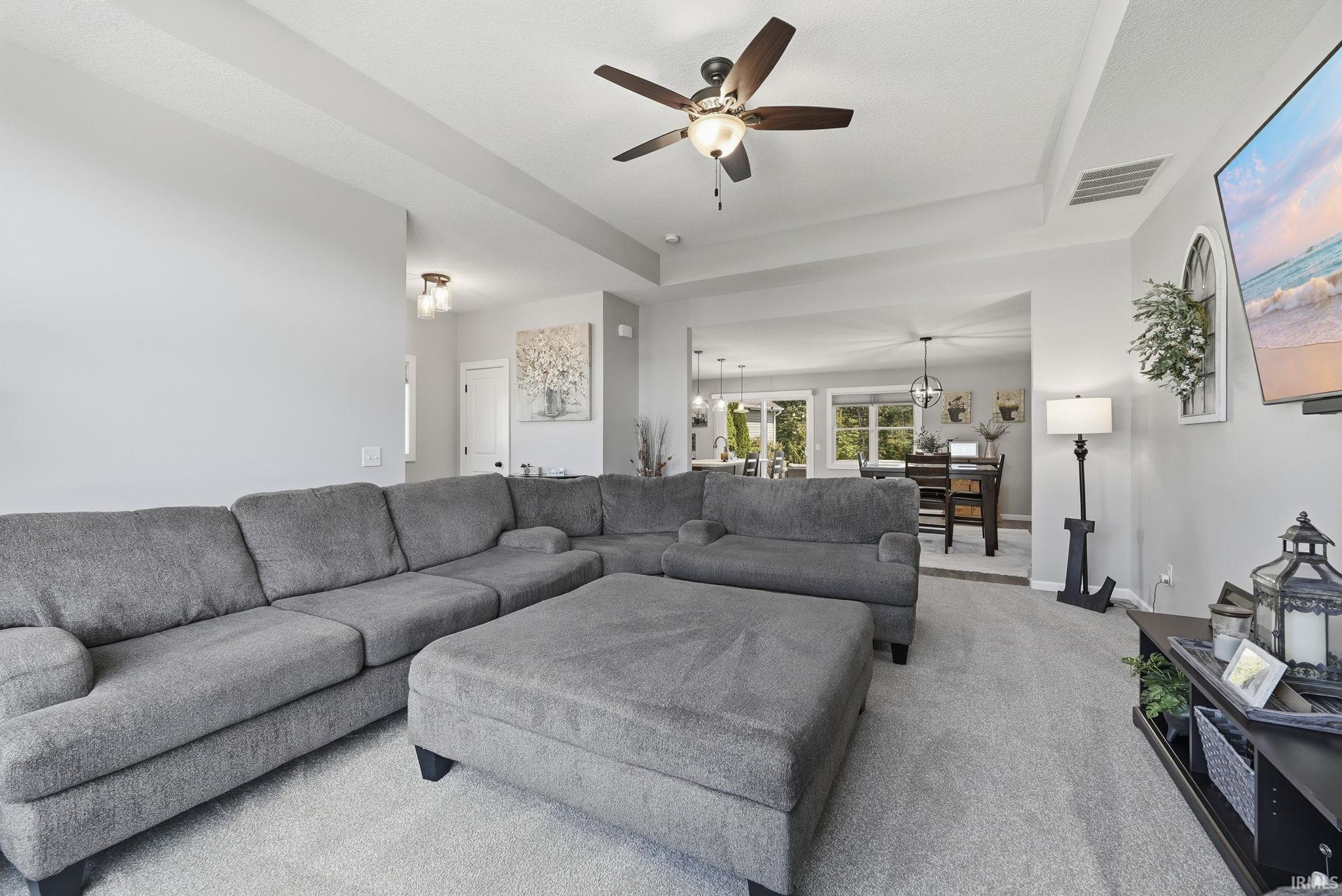 Recessed tray ceiling with a built-in ceiling fan