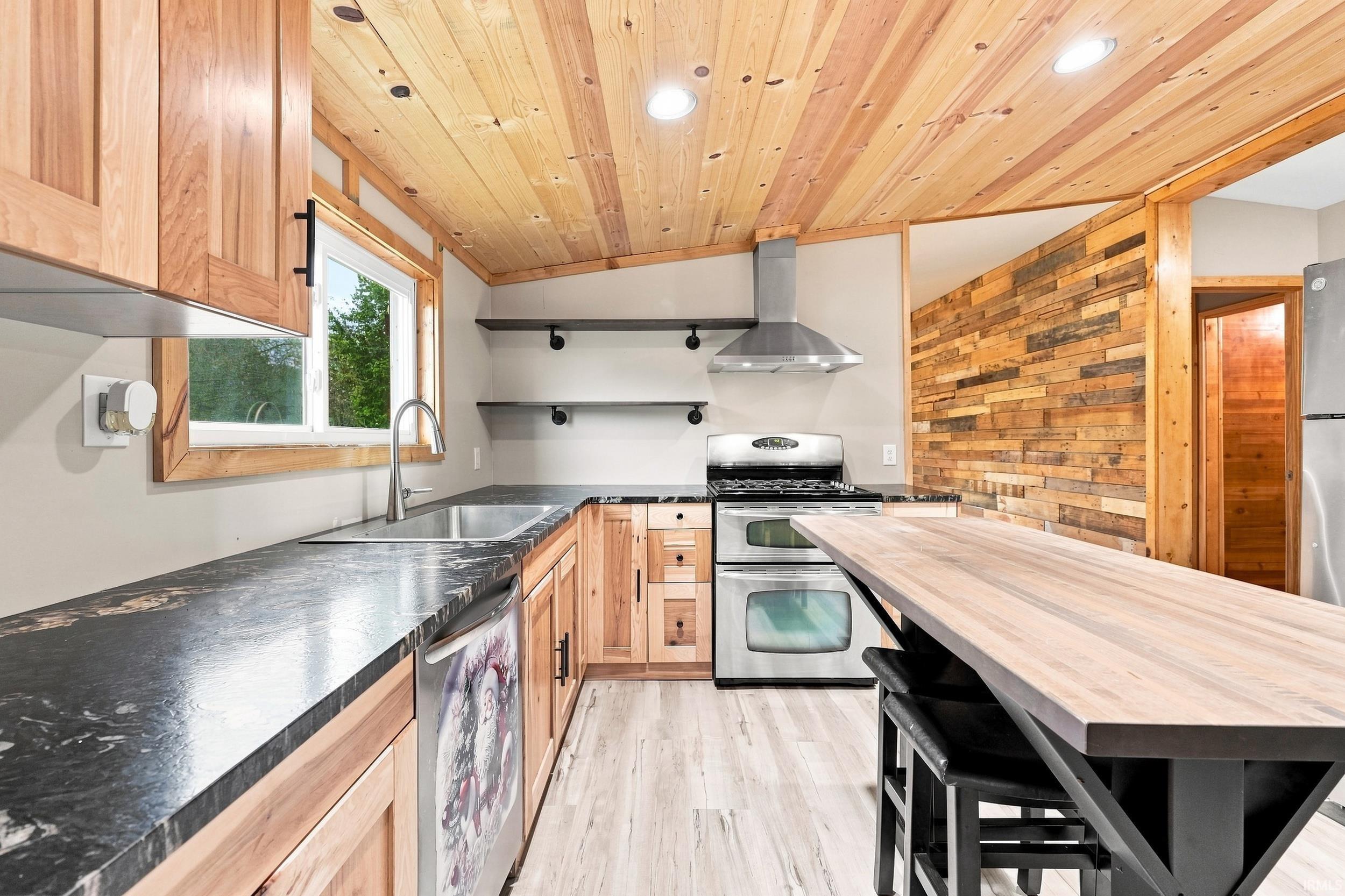 Wood-paneled ceiling with recessed lighting