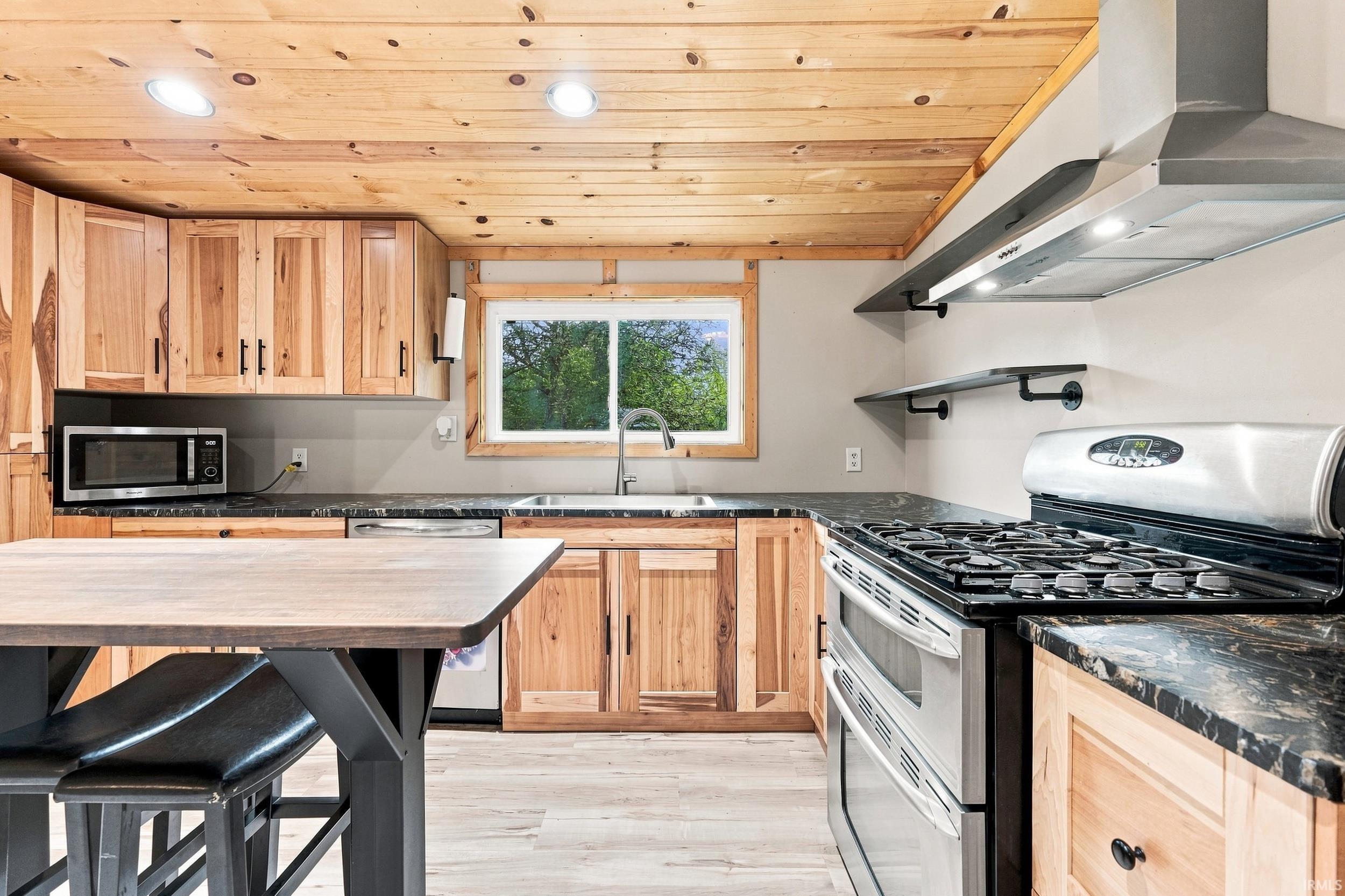 Wood-paneled ceiling with recessed lighting