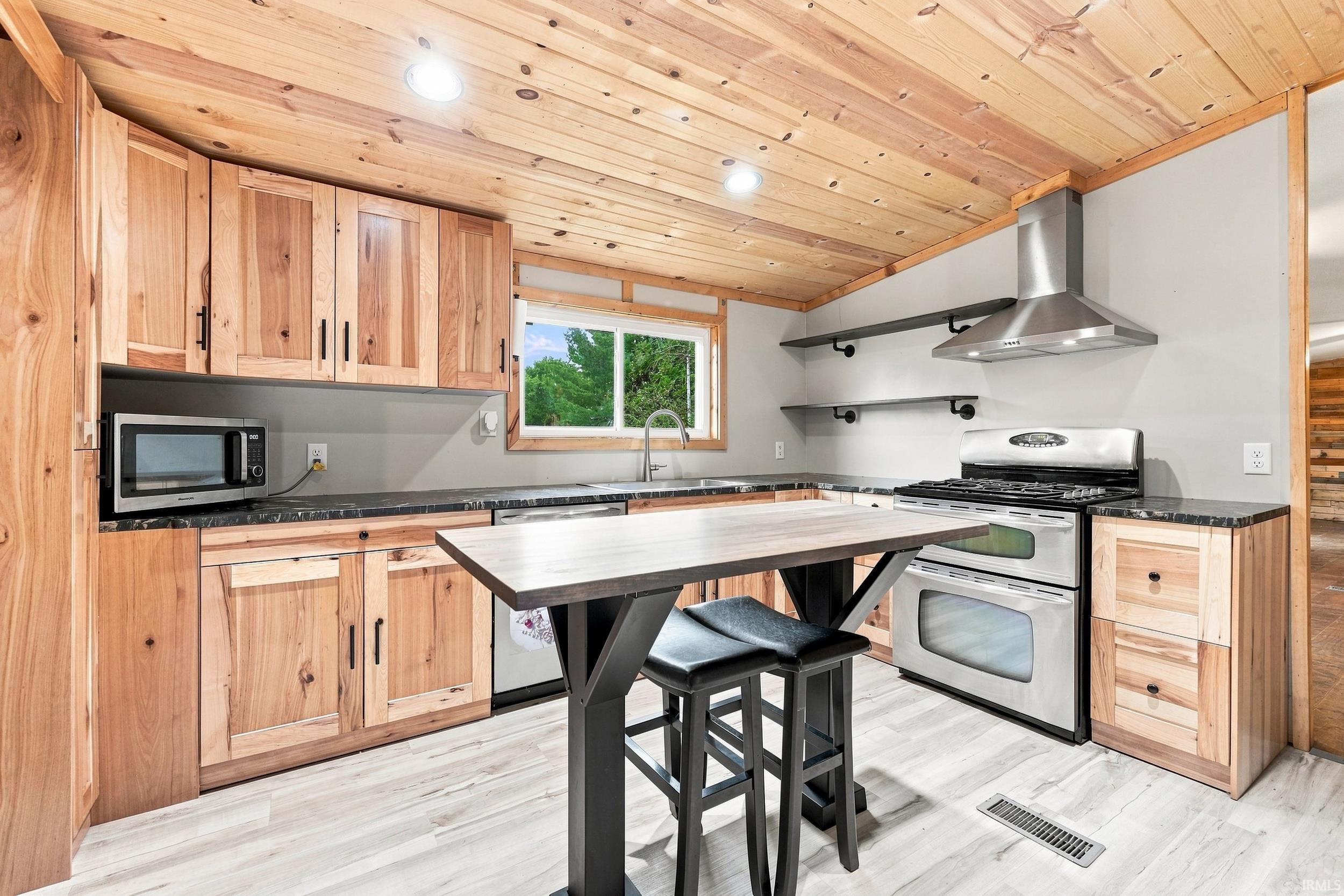 Wood-paneled ceiling with recessed lighting