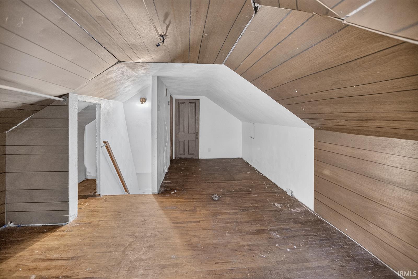 Hardwood floors, sloped ceilings, attic storage and roof access