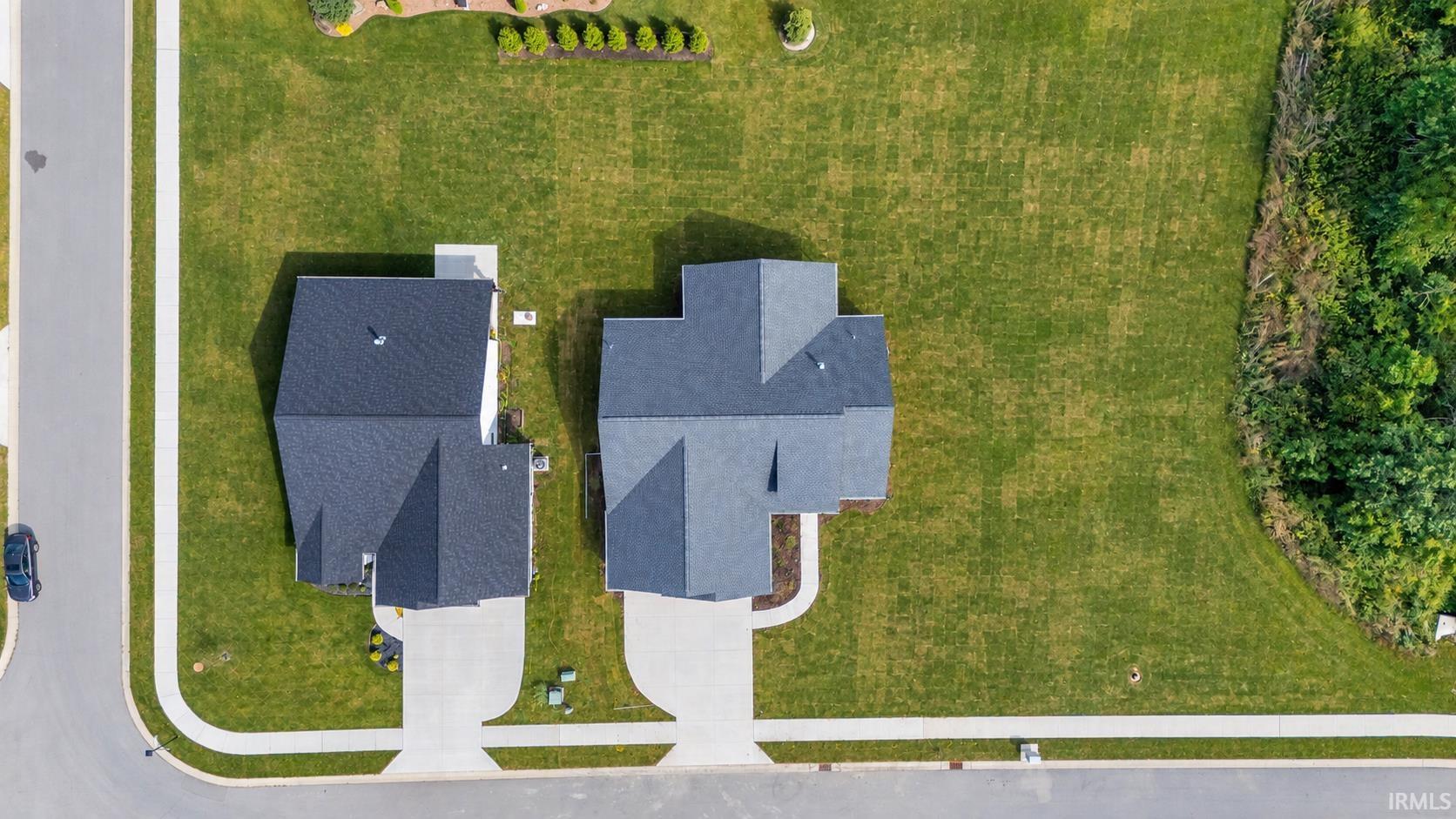 Digitally added grass- lawn will have sod and irrigation in the front, grade and seed in the back