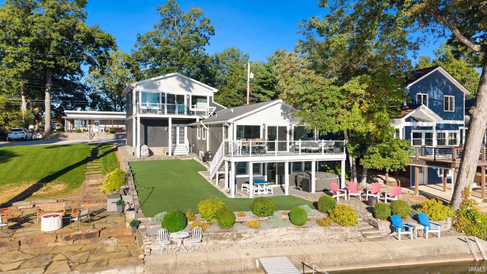 Multi-level exterior with multiple balconies and a ground-level patio