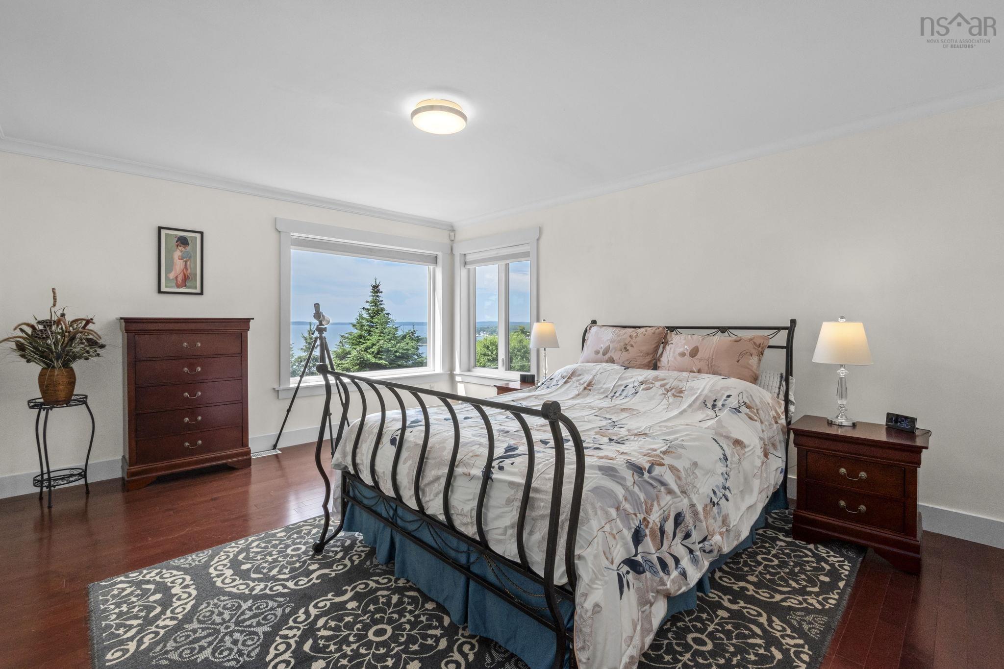 116 Whitecap Ridge, Black Point, NS (MLS® 202618413) — Hardwood-finish flooring featuring a corner window arrangement with significant natural light
