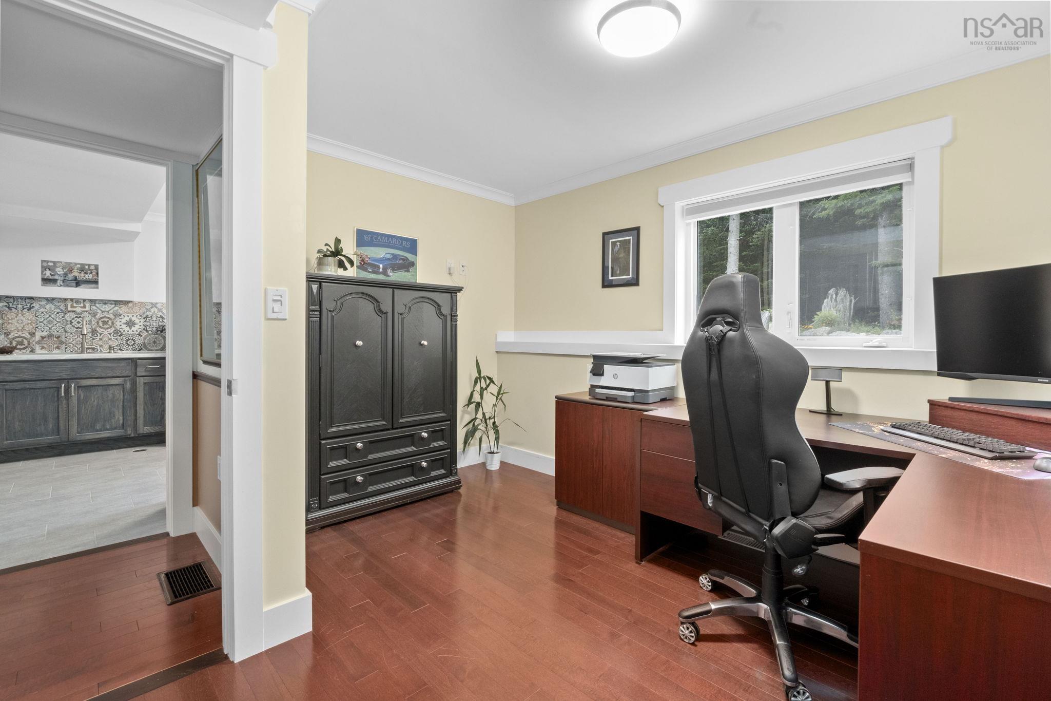 116 Whitecap Ridge, Black Point, NS (MLS® 202618413) — Room featuring wood-finish flooring, a window with exterior views, and a neutral wall color