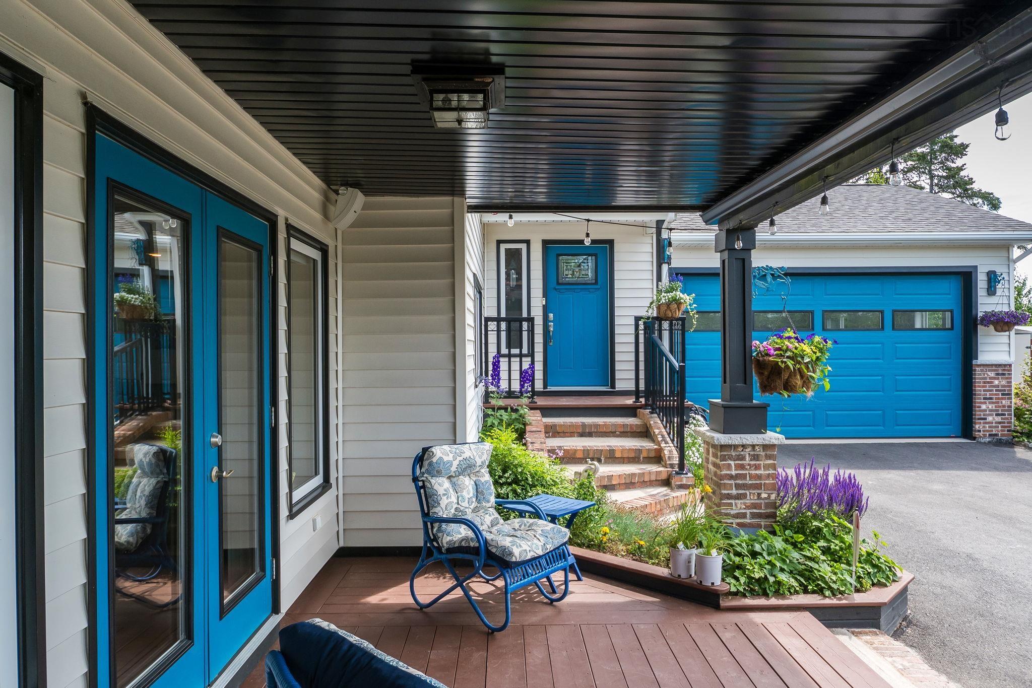 116 Whitecap Ridge, Black Point, NS (MLS® 202618413) — Covered wood-finish porch with a dark ceiling and light siding