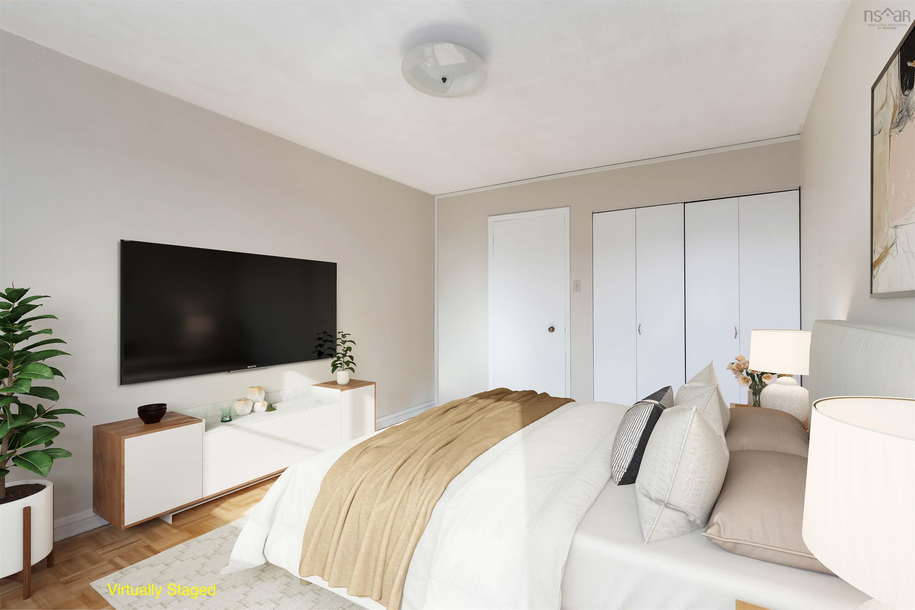 1601 5959 Spring Garden Road, Halifax, NS (MLS® 202620845) — Recessed lighting, wood-finish flooring, white walls, and built-in closet with white doors