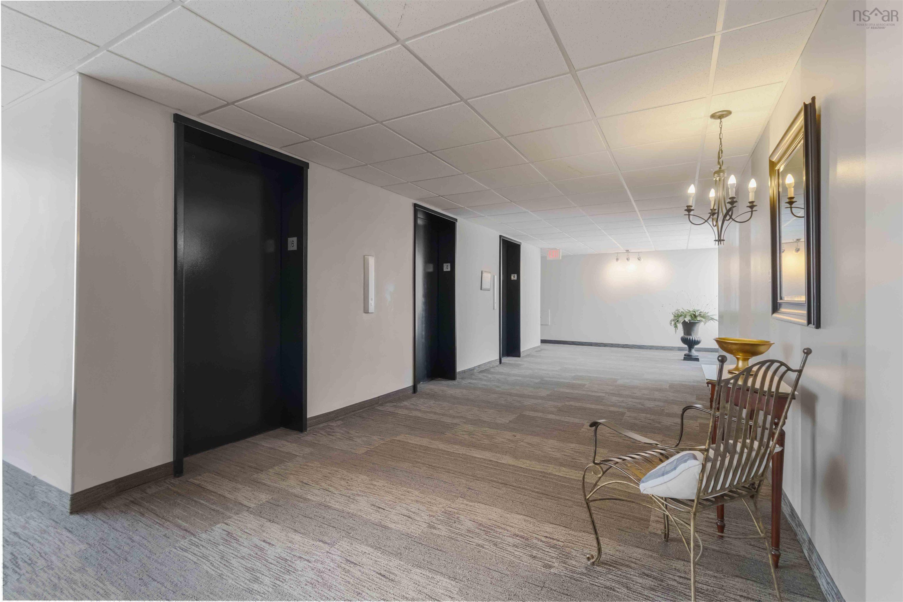 1601 5959 Spring Garden Road, Halifax, NS (MLS® 202620845) — Hallway featuring neutral-toned walls, textured carpet flooring, and recessed lighting