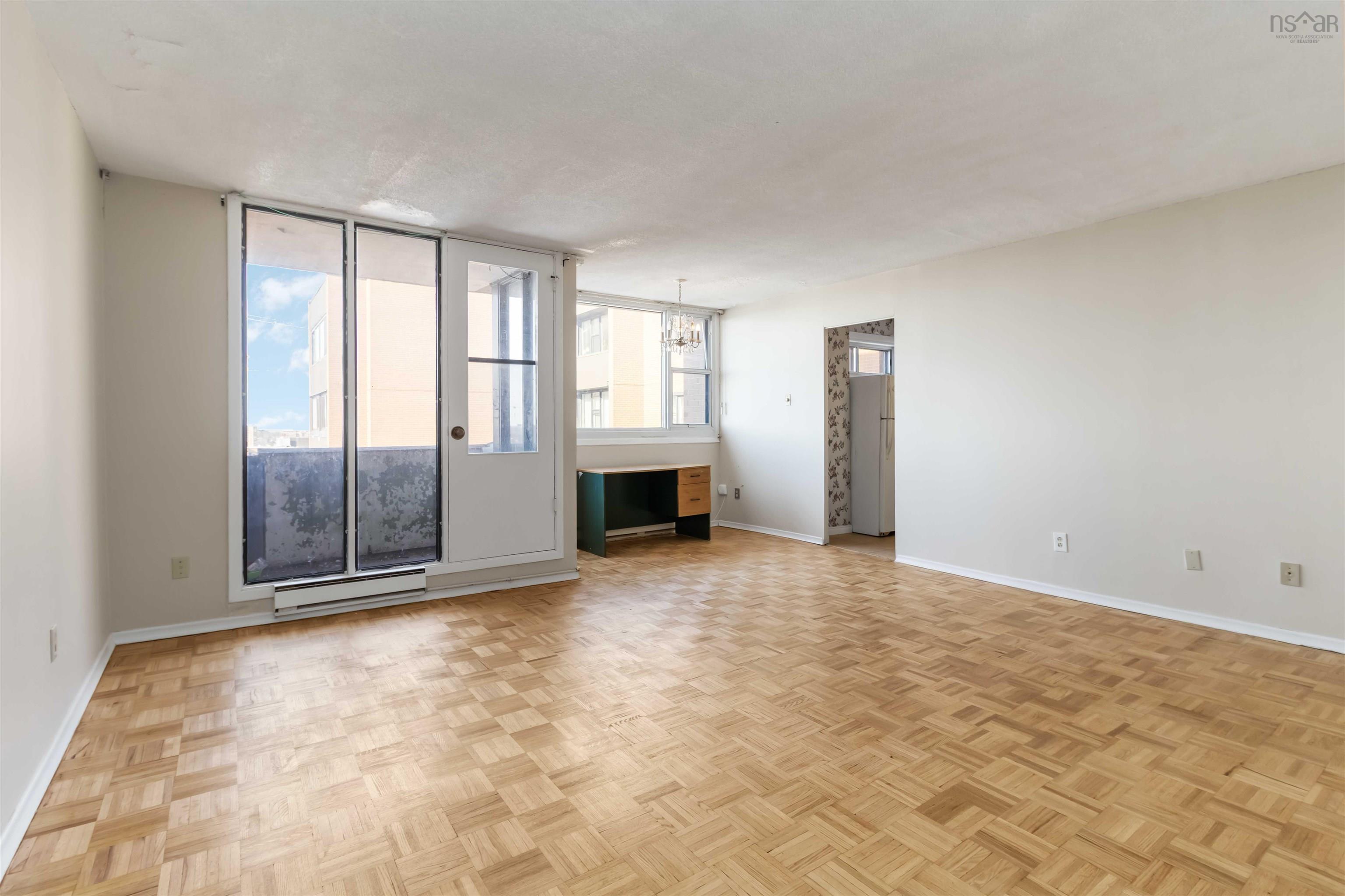 1601 5959 Spring Garden Road, Halifax, NS (MLS® 202620845) — Parquet flooring, white walls, and a glass-paneled door