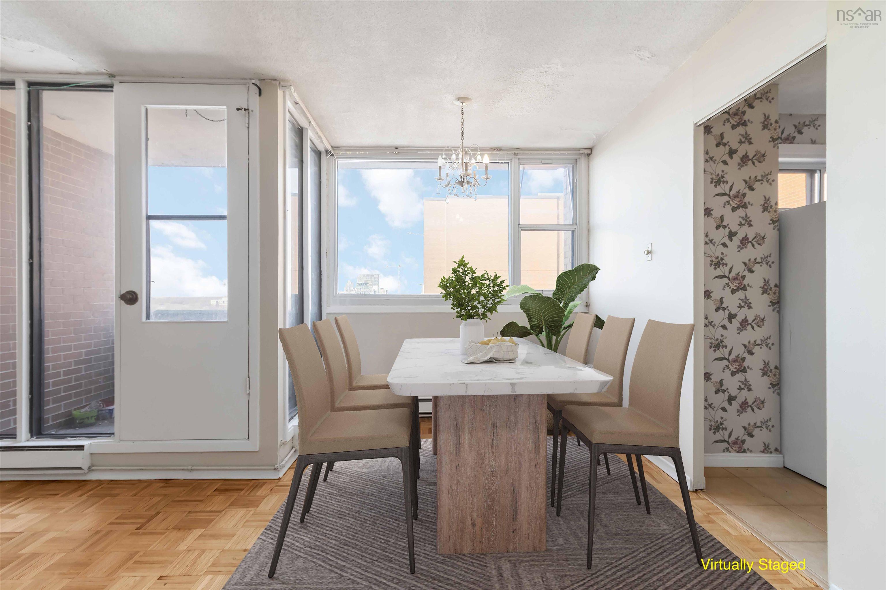 1601 5959 Spring Garden Road, Halifax, NS (MLS® 202620845) — Parquet wood flooring, chandelier lighting, and a white door with glass paneling