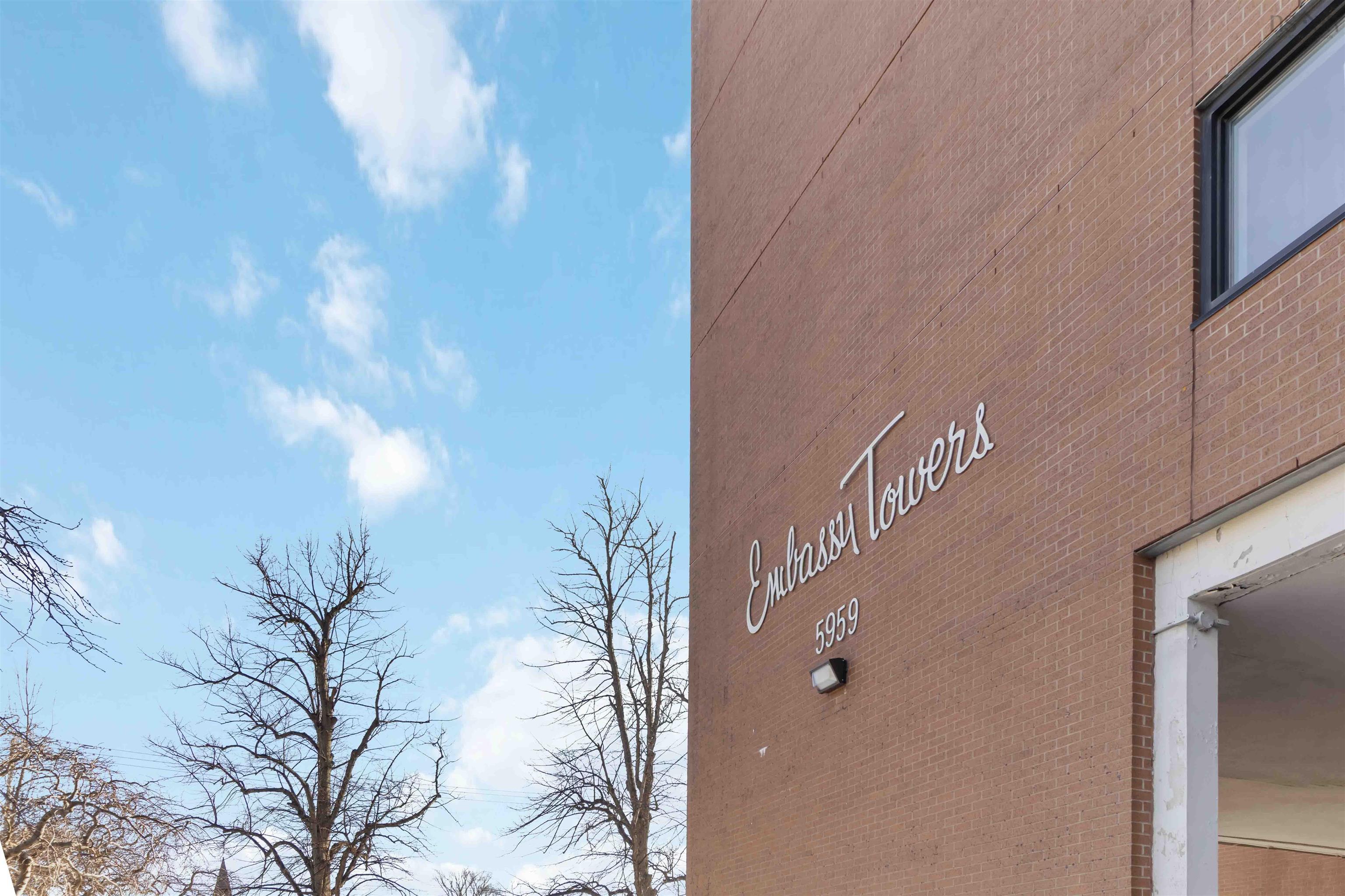 1601 5959 Spring Garden Road, Halifax, NS (MLS® 202620845) — Brick exterior facade with "Embassy Towers" signage and building number 5959