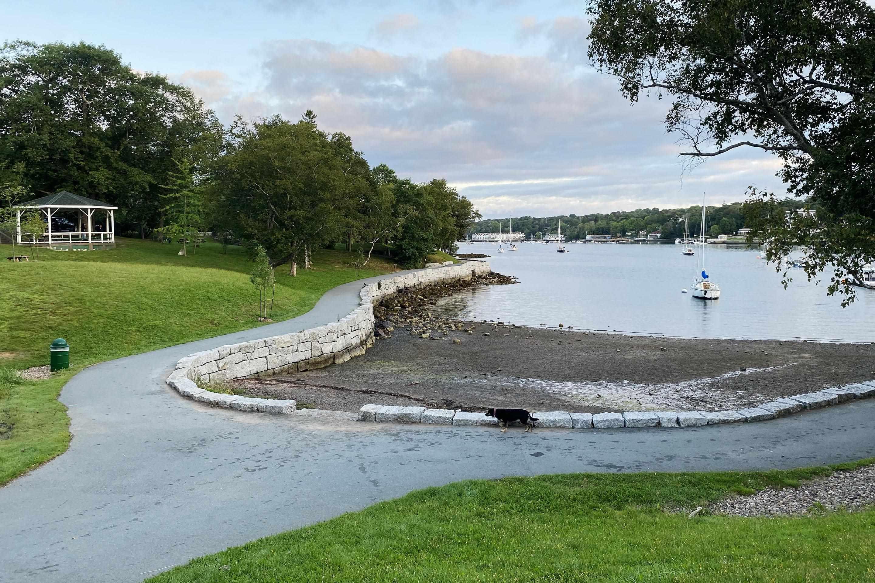 1237 Purcells Cove Road, Halifax, NS (MLS® 202622232) — Waterfront property featuring a stone retaining wall, paved walking path, expansive green lawn, and a white gazebo