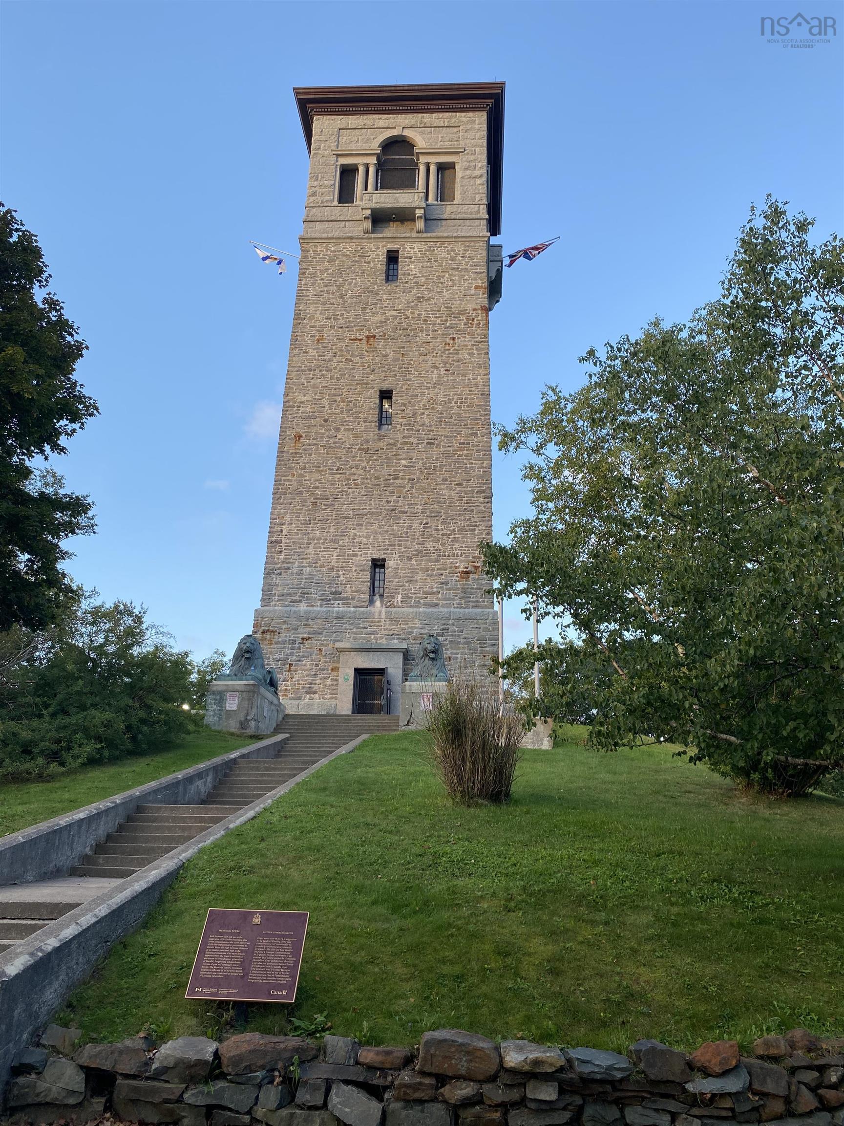 1237 Purcells Cove Road, Halifax, NS (MLS® 202622232) — Stone-clad tower with a prominent entrance, stone staircase, and mature landscaping