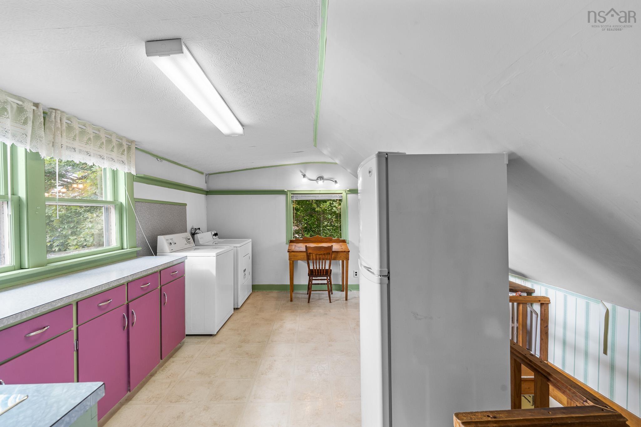 28 Arlington Place, Truro, NS (MLS® 202623012) — This spacious, light-filled bonus room offers endless possibilities! Currently serving as a laundry area, it would make a wonderful playroom, craft room or creative workspace. Complete with a convenient second staircase leading directly to the main-floor