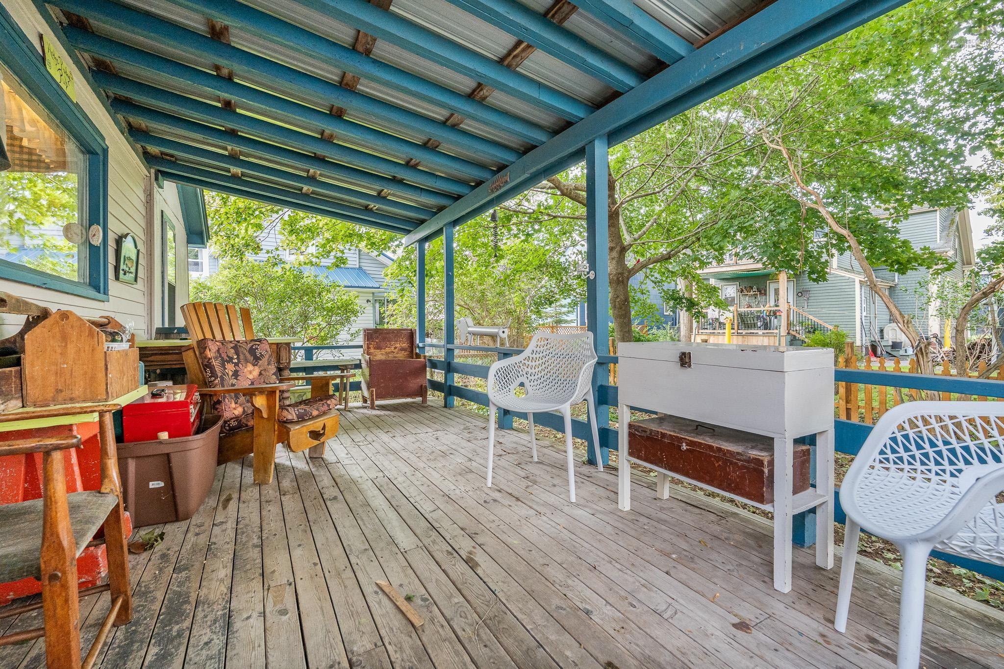 28 Arlington Place, Truro, NS (MLS® 202623012) — A charming covered back veranda, perfect for sipping your morning coffee or afternoon tea while enjoying the sights and sounds of the garden, rain or shine.