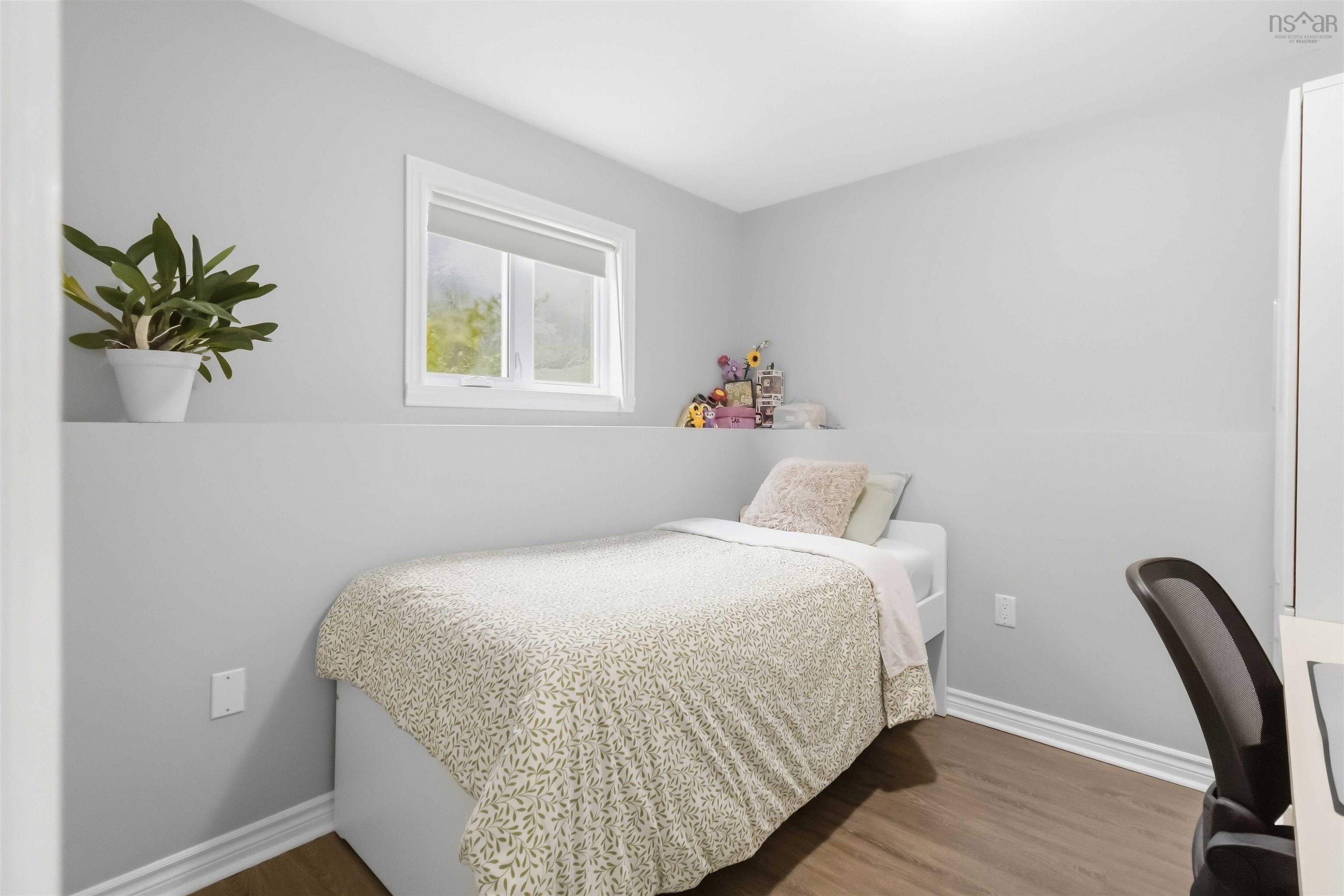 34 Lindsay Court, Lower Sackville, NS (MLS® 202624063) — Light gray walls with a white trim window, wood-finish flooring, and white baseboards