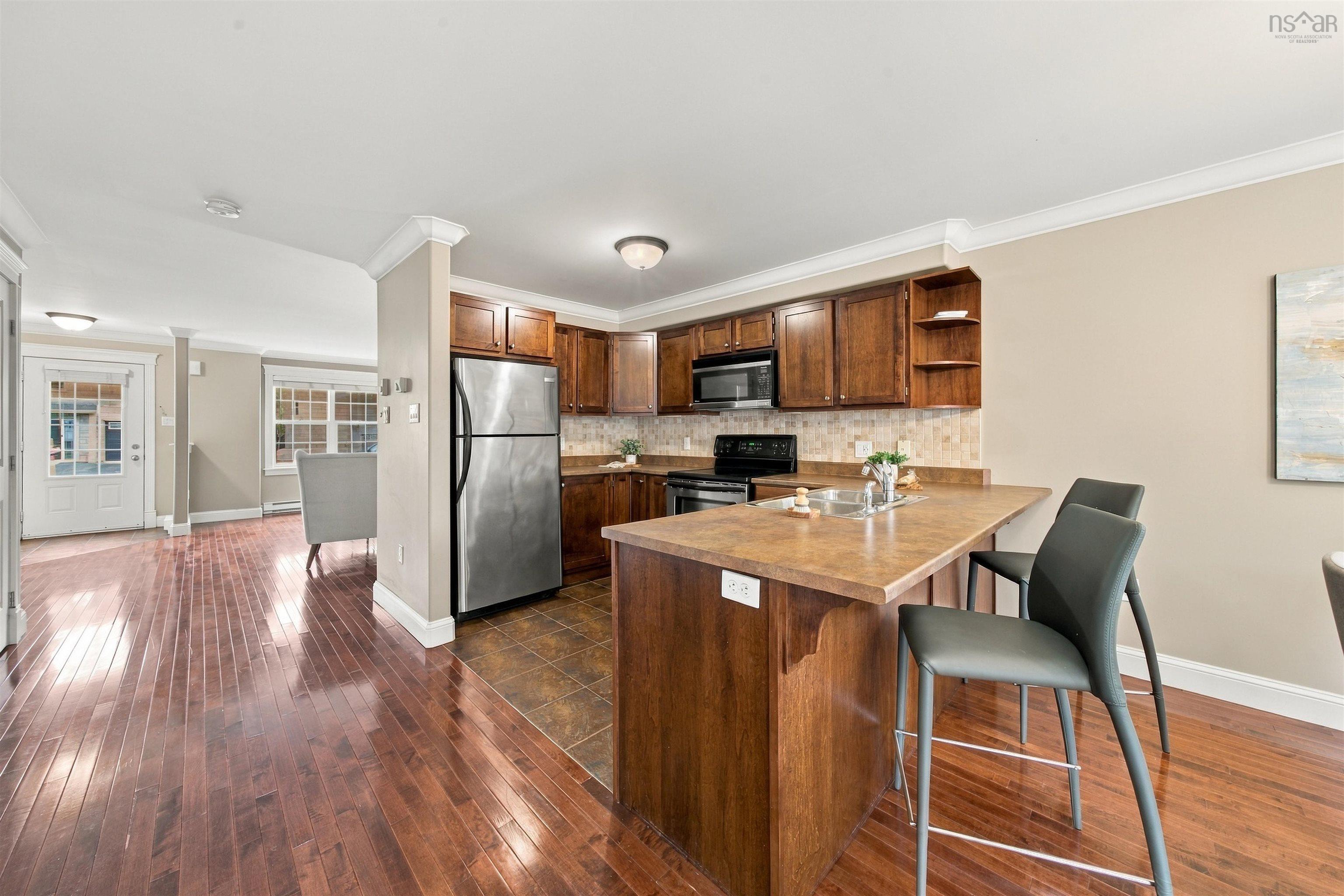 150 Transom Drive, Halifax, NS (MLS® 202625460) — Hardwood-finish flooring, recessed lighting, crown molding, kitchen island with integrated sink, and stainless steel appliances