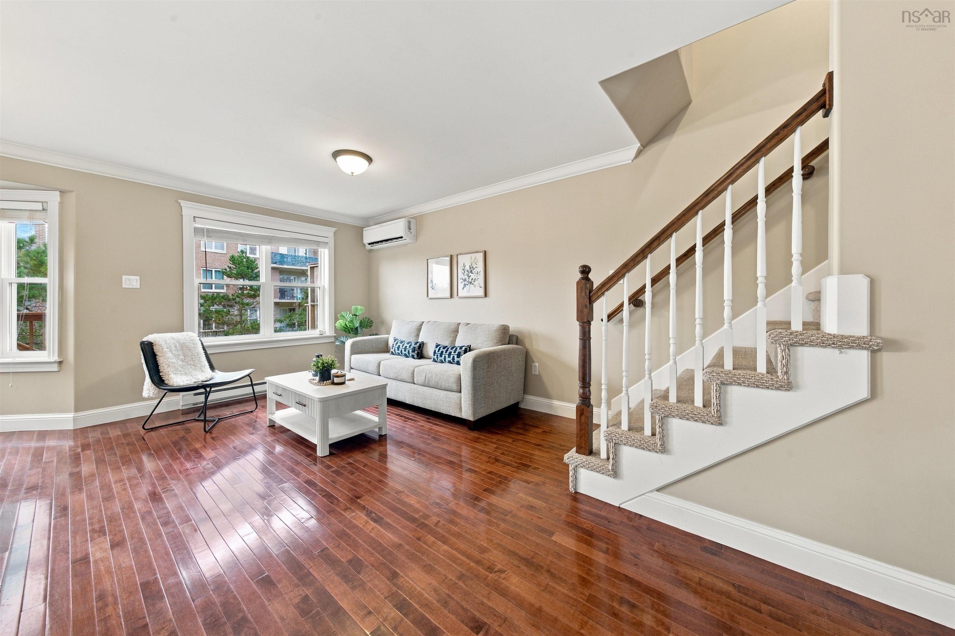 150 Transom Drive, Halifax, NS (MLS® 202625460) — Hardwood flooring, white crown molding, dual pane windows, a mini-split system, and a staircase with carpeted treads