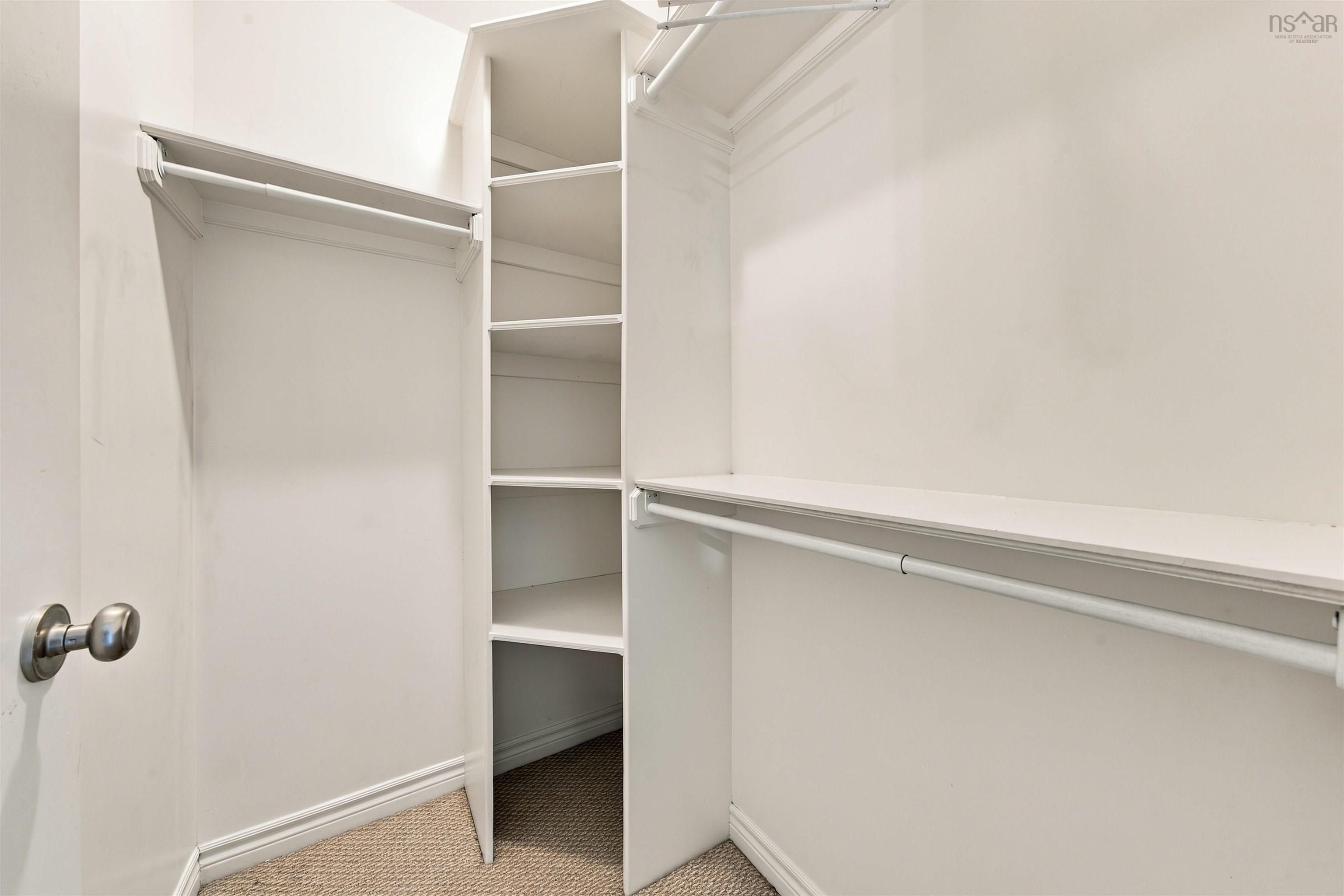 150 Transom Drive, Halifax, NS (MLS® 202625460) — Walk-in closet with carpet flooring, built-in shelving, and multiple hanging rods