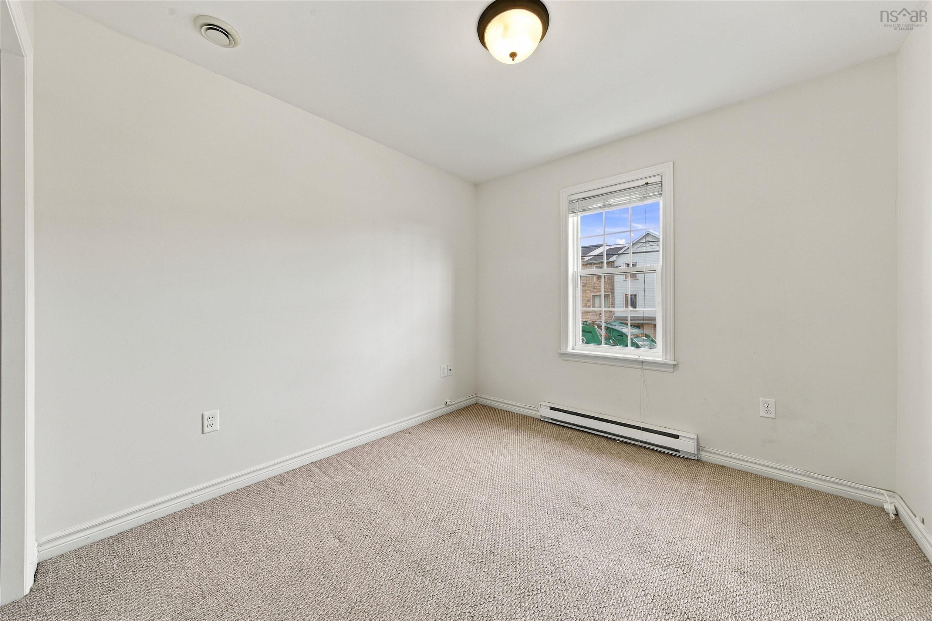 150 Transom Drive, Halifax, NS (MLS® 202625460) — Carpeted flooring with white wall trim, a double-hung window, and a flush mount ceiling light fixture