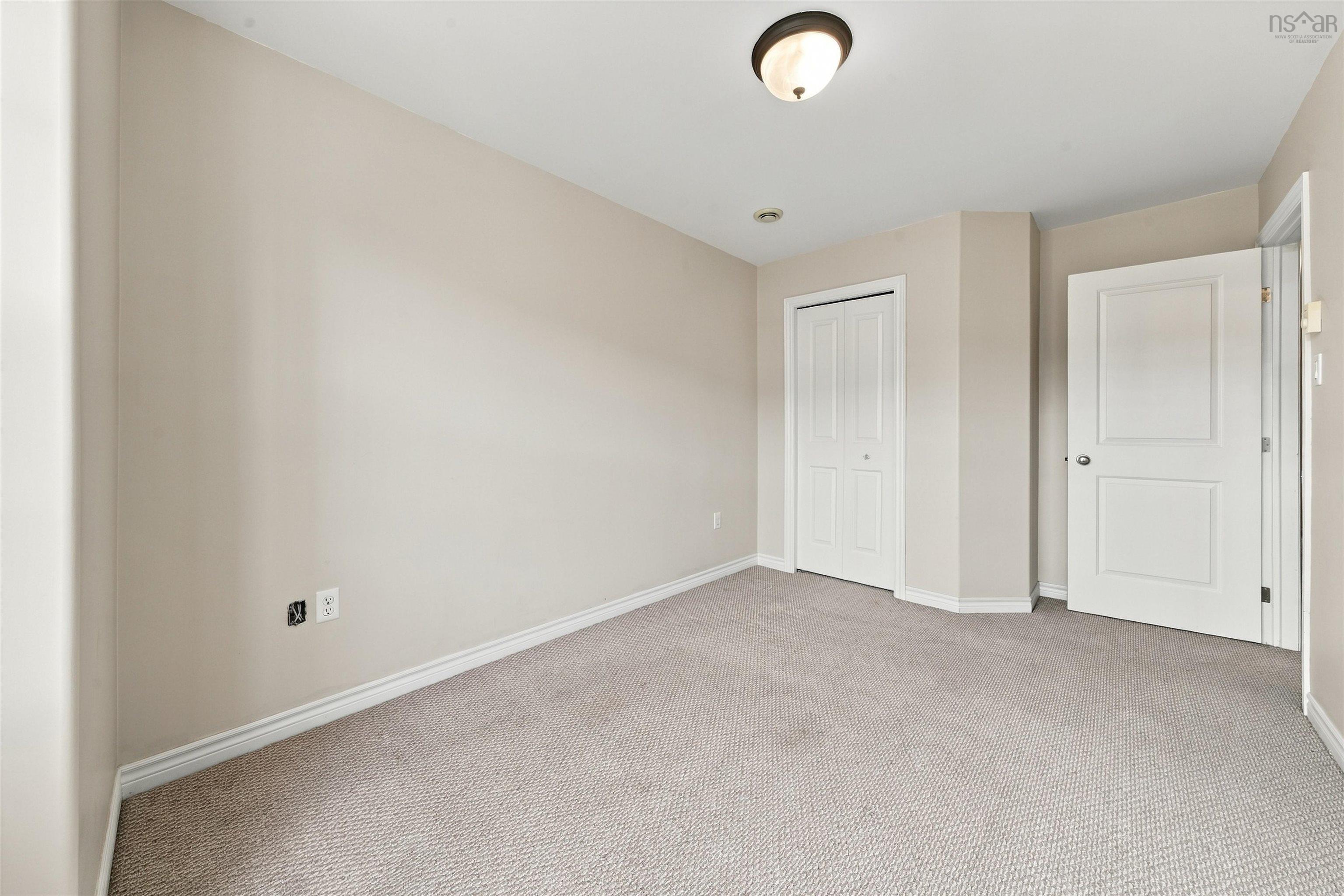 150 Transom Drive, Halifax, NS (MLS® 202625460) — Neutral-toned walls, light-colored carpet, a ceiling-mounted light fixture, and white interior doors