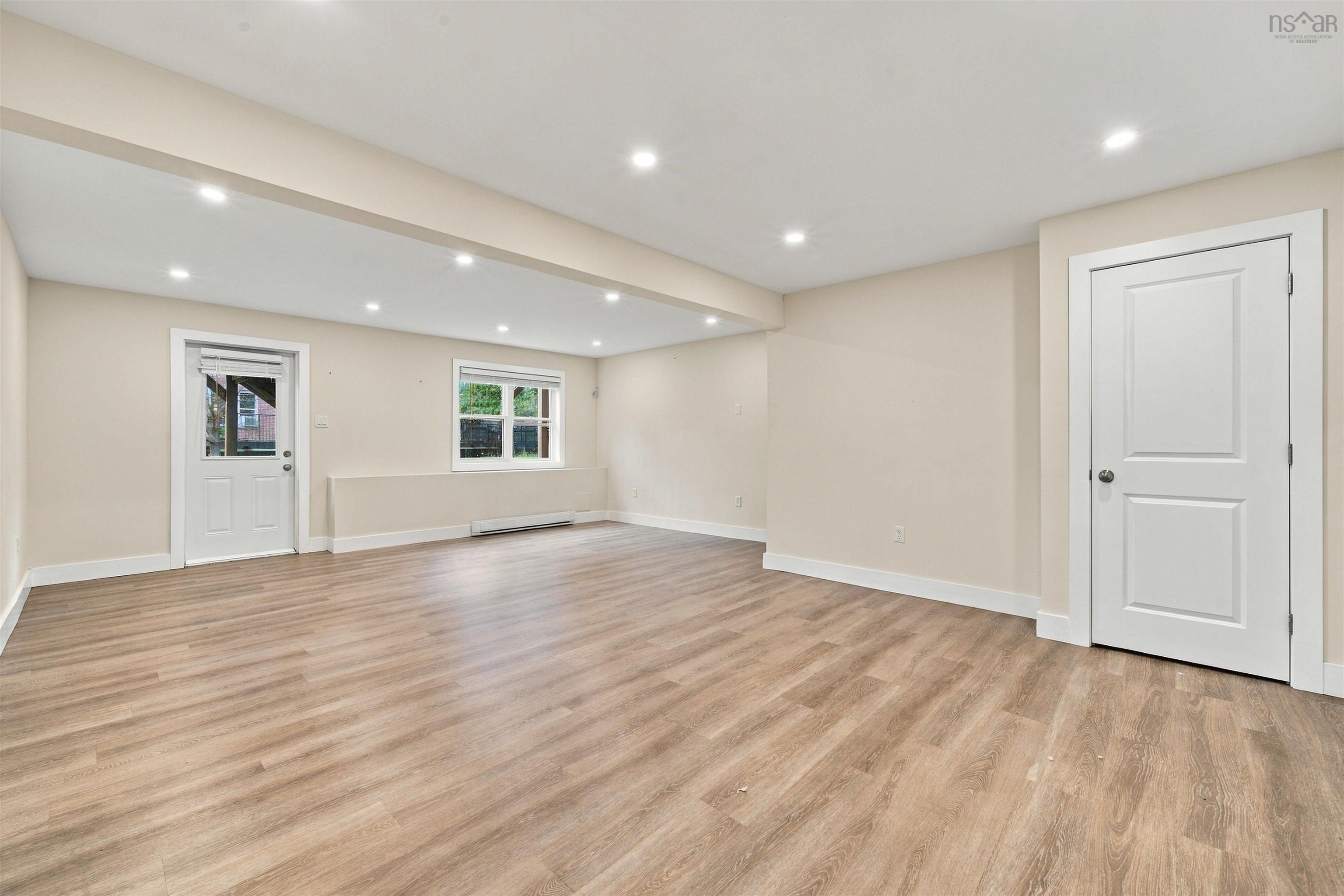 150 Transom Drive, Halifax, NS (MLS® 202625460) — Recessed lighting, wood-finish flooring, white trim, and a white paneled door