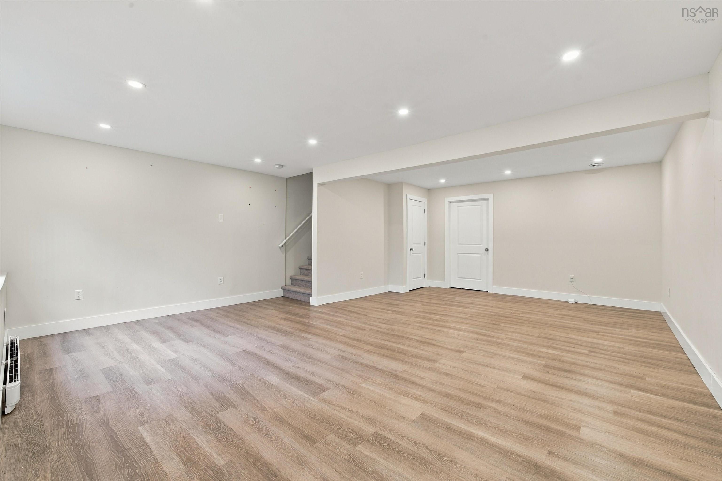 150 Transom Drive, Halifax, NS (MLS® 202625460) — Spacious open-concept room featuring wood-finish flooring, recessed lighting, and a neutral color palette