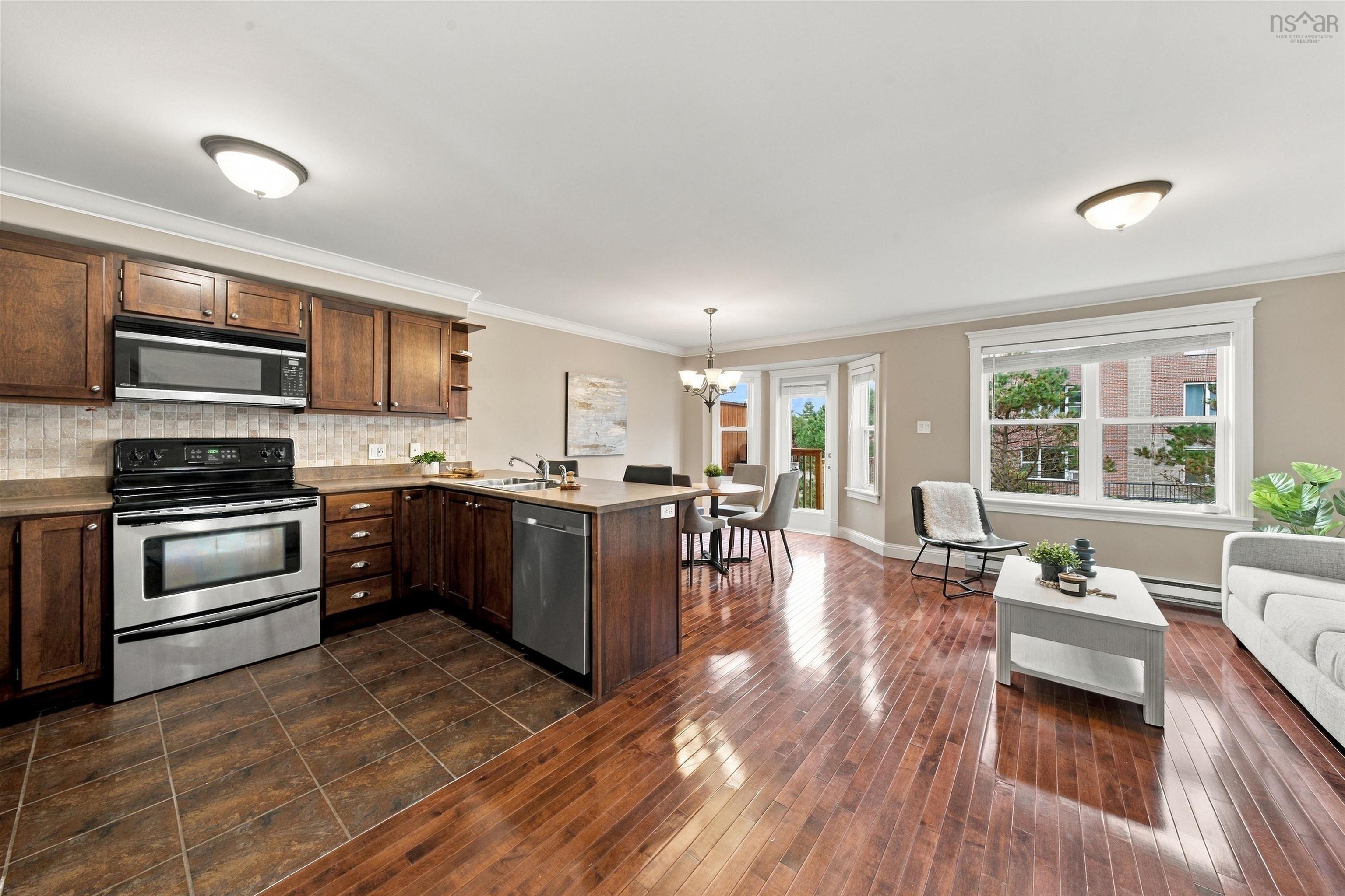 150 Transom Drive, Halifax, NS (MLS® 202625460) — Kitchen featuring stainless steel appliances, wood-finish cabinetry, and a tile backsplash