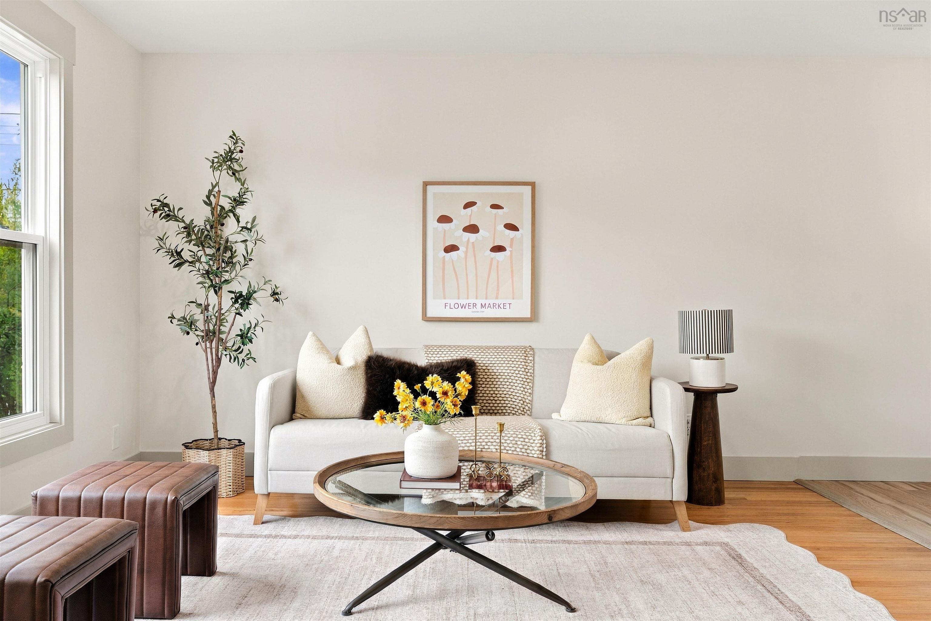74 1/2 Belle Vista Drive, Dartmouth, NS (MLS® 202625912) — Neutral-toned interior space featuring light wood-finish flooring, crisp white walls, and a large sash window