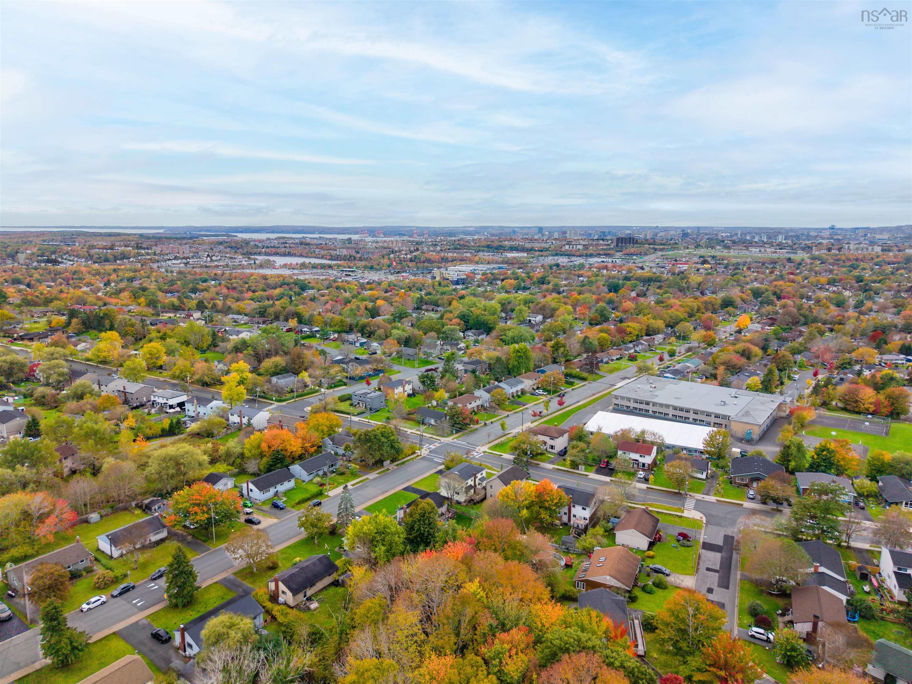 74 1/2 Belle Vista Drive, Dartmouth, NS (MLS® 202625912) — Aerial perspective featuring established residential streets, mature tree canopy, and expansive urban scenery