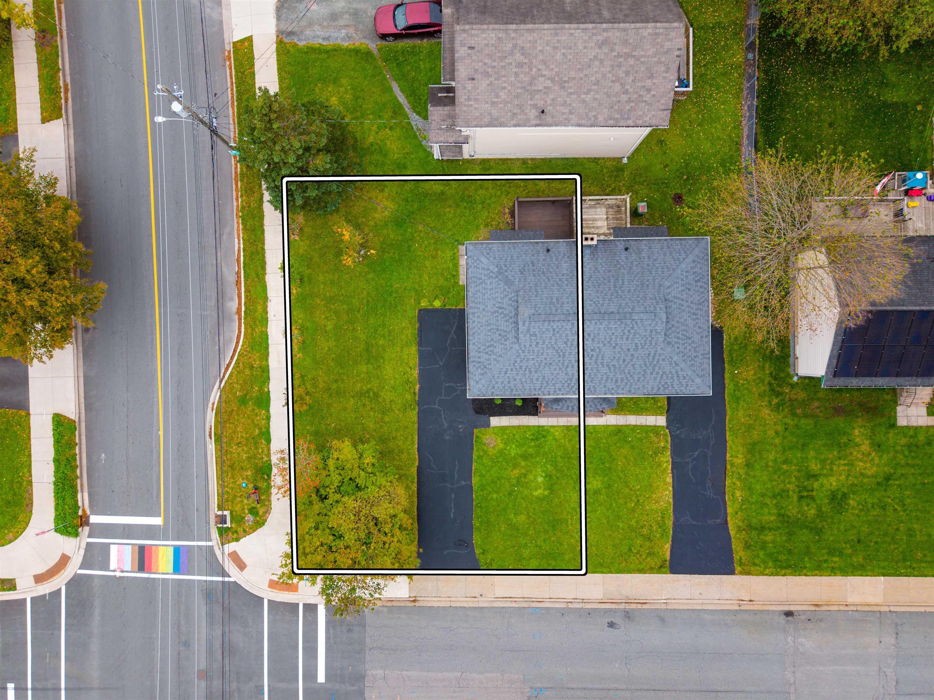 74 1/2 Belle Vista Drive, Dartmouth, NS (MLS® 202625912) — Aerial view of the property featuring a rectangular lot, paved driveway, and established lawn
