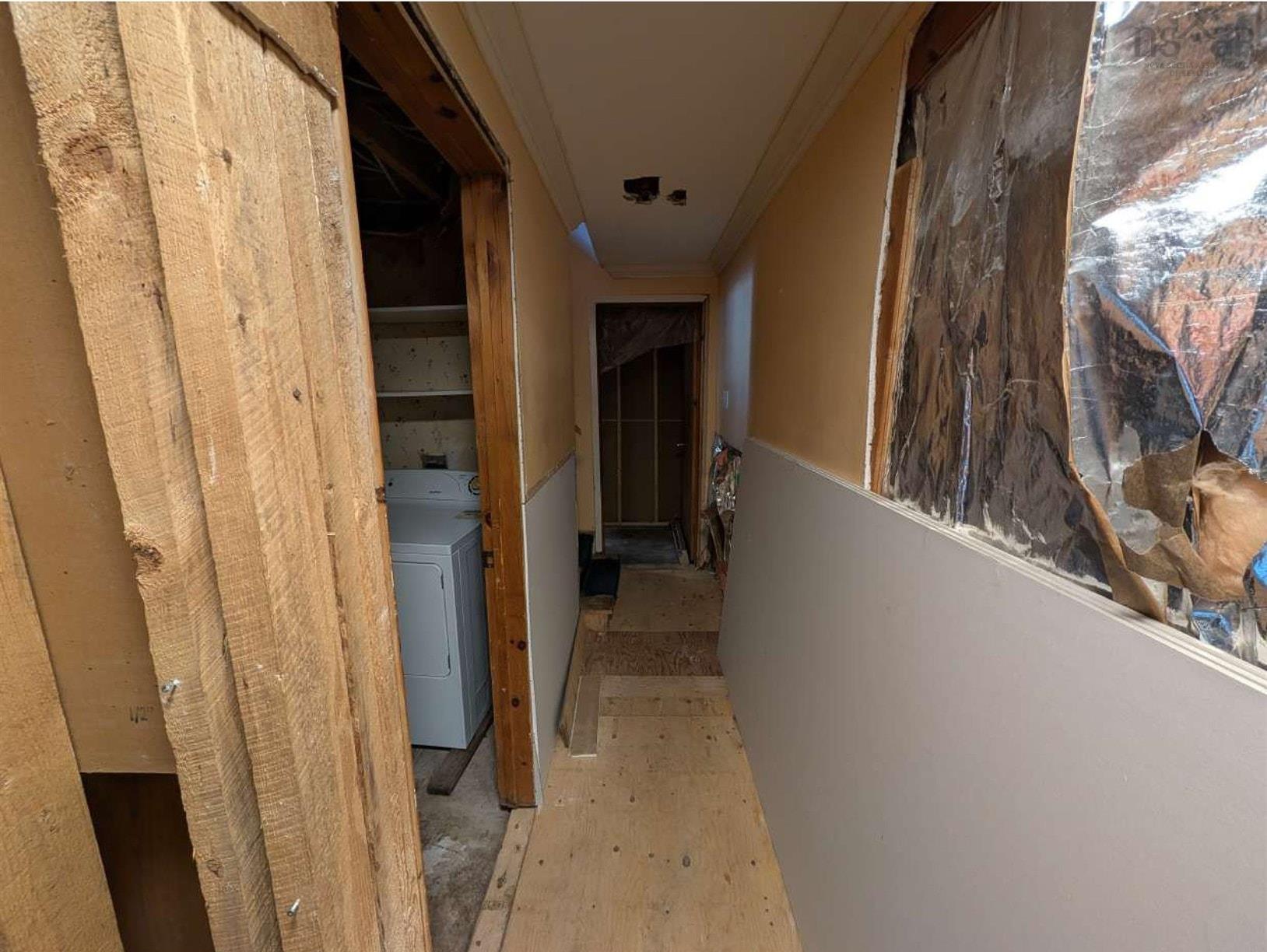 19 Foster Avenue, Fall River, NS (MLS® 202625937) — Interior space featuring exposed wood framing, partially installed drywall panels, and exposed structural plywood flooring