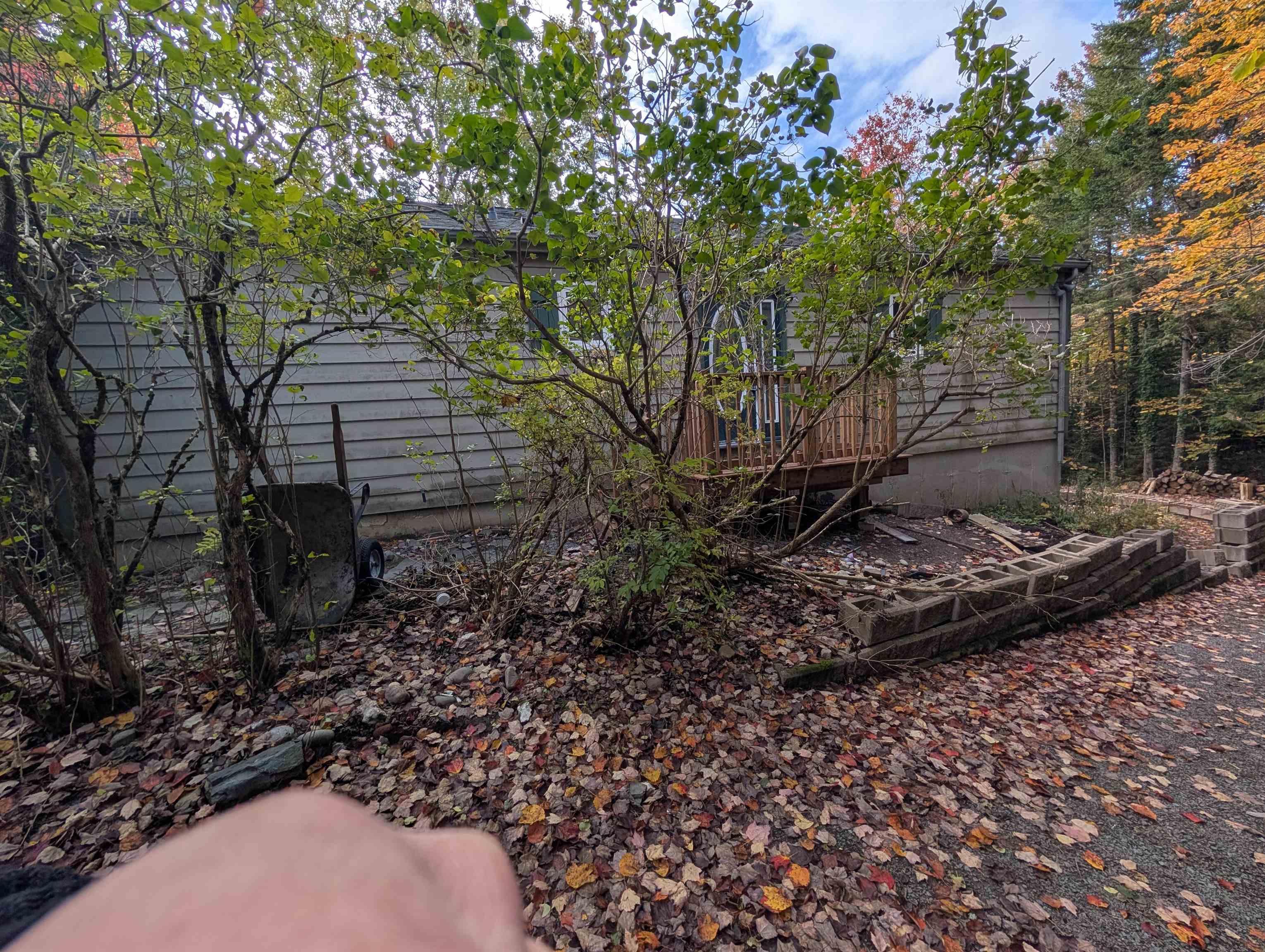 19 Foster Avenue, Fall River, NS (MLS® 202625937) — Horizontal lap siding exterior with an elevated wooden deck and a concrete block retaining wall